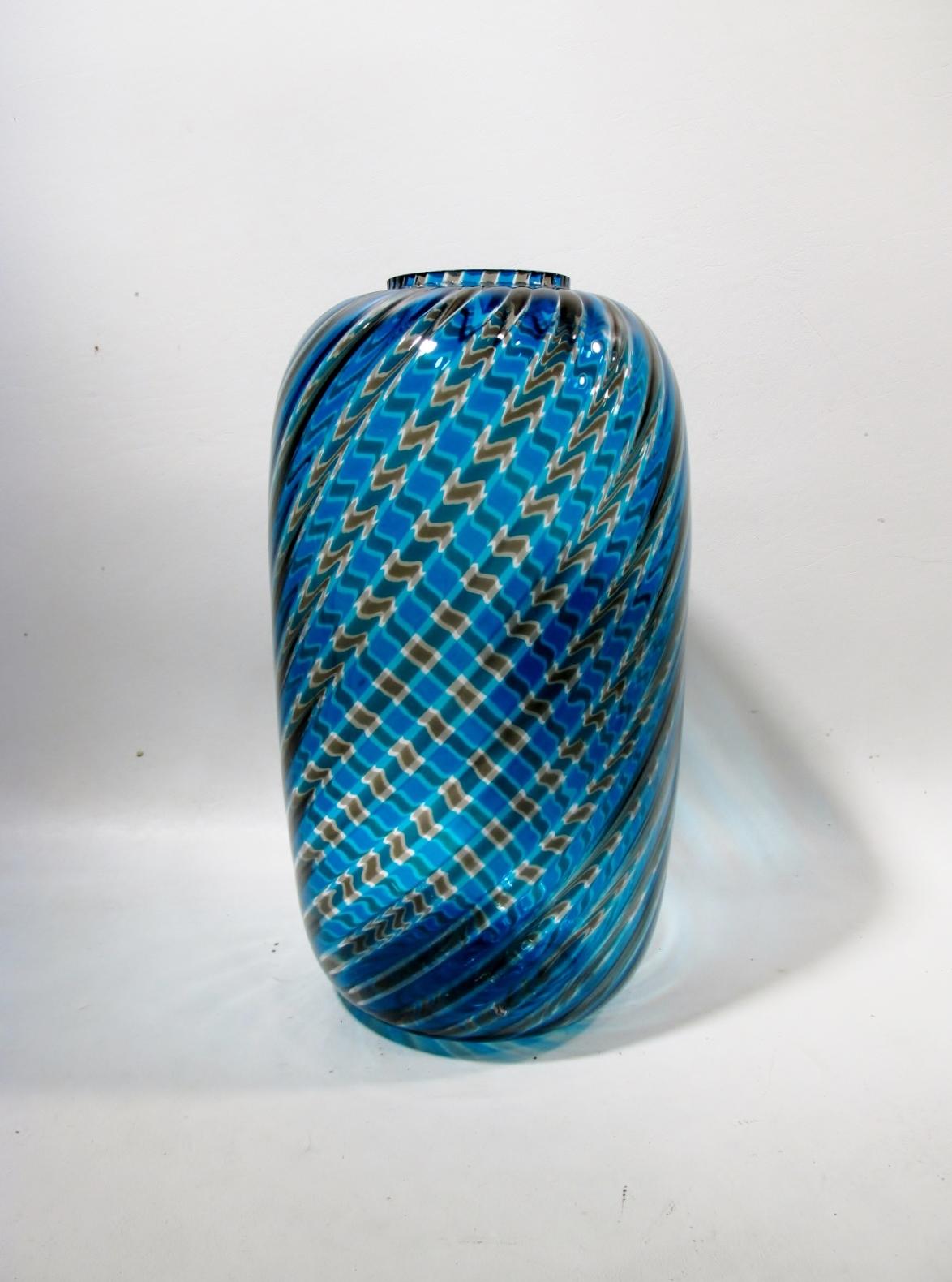 Iconic modernist 10” tall and 6” diameter swirling “A Canna” Venetian glass vase by Paolo Venini for his renowned workshop. Signed to base Venini Italia, 1981.