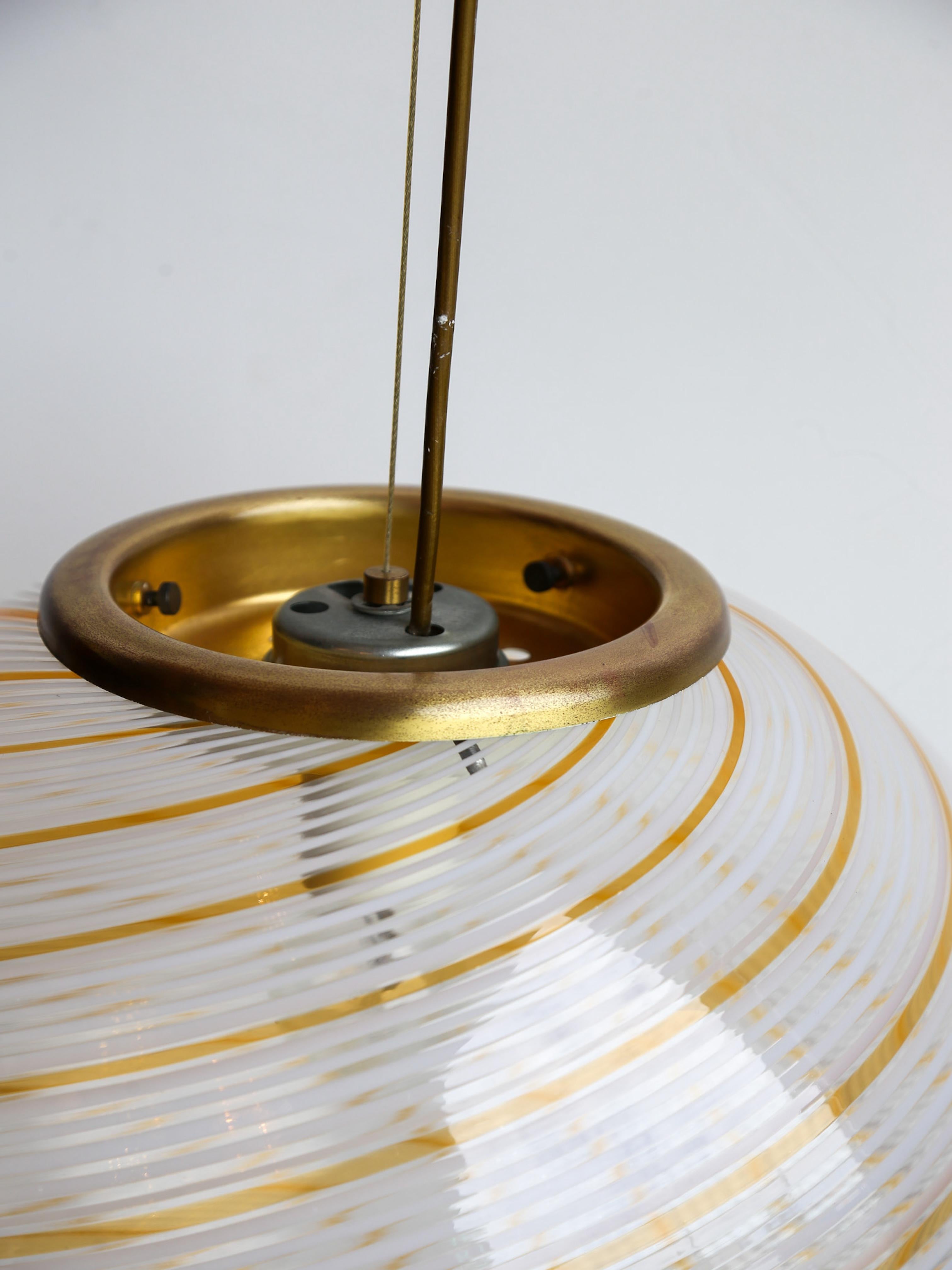 This Italian Vintage Murano Glass Pendant Light is a beautiful example of mid-century modern design from the 1960s. Murano glass is known for its high quality and intricate handcrafted techniques, making this pendant light a true work of art.

Paolo