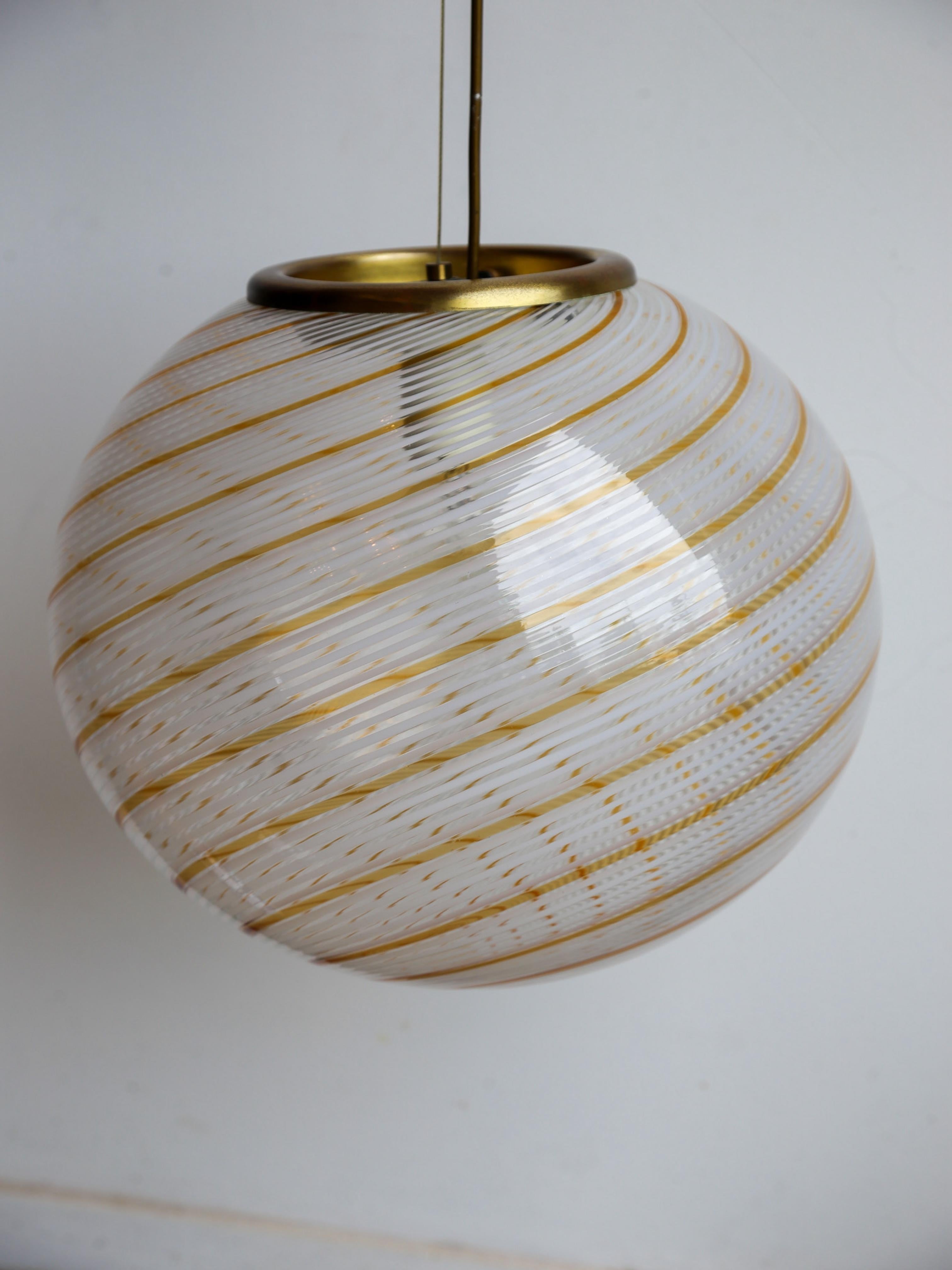 Mid-20th Century Paolo Venini Spherical Murano Glass and Brass Pendant Light For Sale