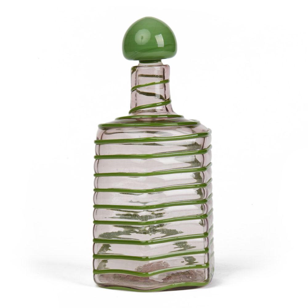 A rare Italian, Paolo Venini overlaid glass decanter hexagonal shaped in slightly pink tinted glass with applied green glass trailed piping evenly applied around the body of the decanter with a mushroom shaped green glass cased matching stopper. The