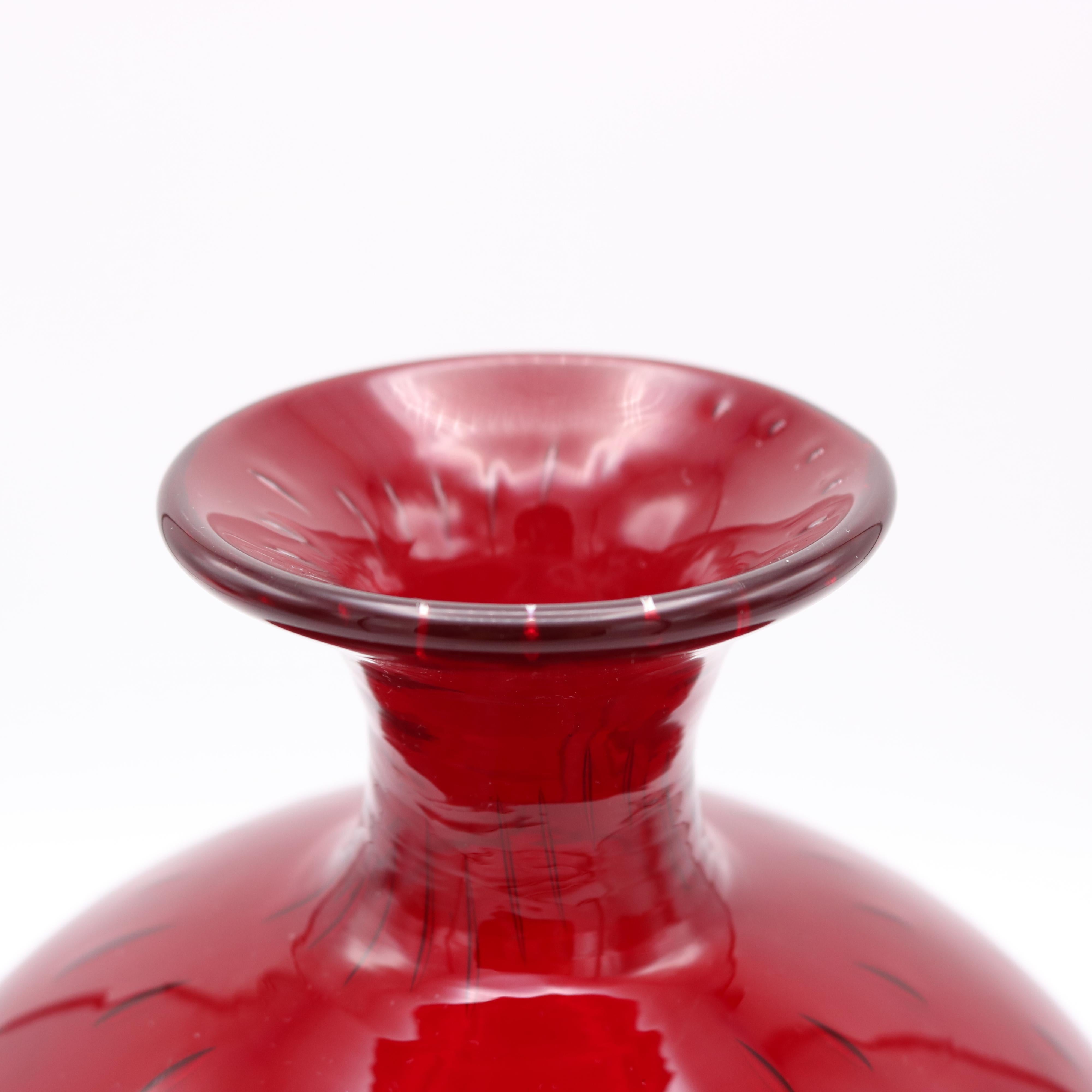 A Paolo Venini. 'A Bolle' Murano glass vase.
Murano glass, clear and ruby-red with air-inclusions. 
Signed: Venini Murano Italia.