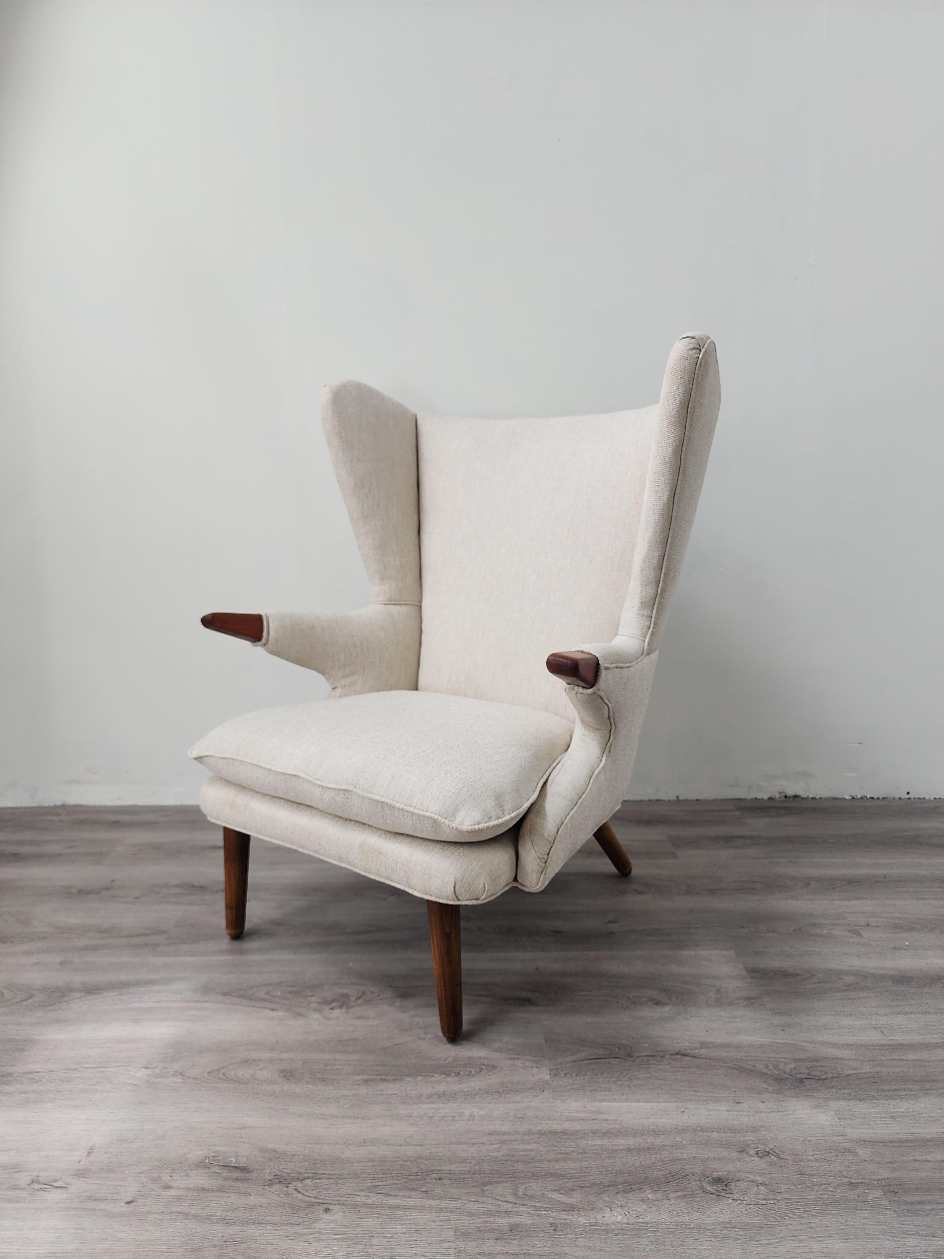 This incredible wing chair was purchased in Denmark and recently imported to the US. The iconic model 91 chair, also referred to as the Papa Bear Chair thanks to its teak 