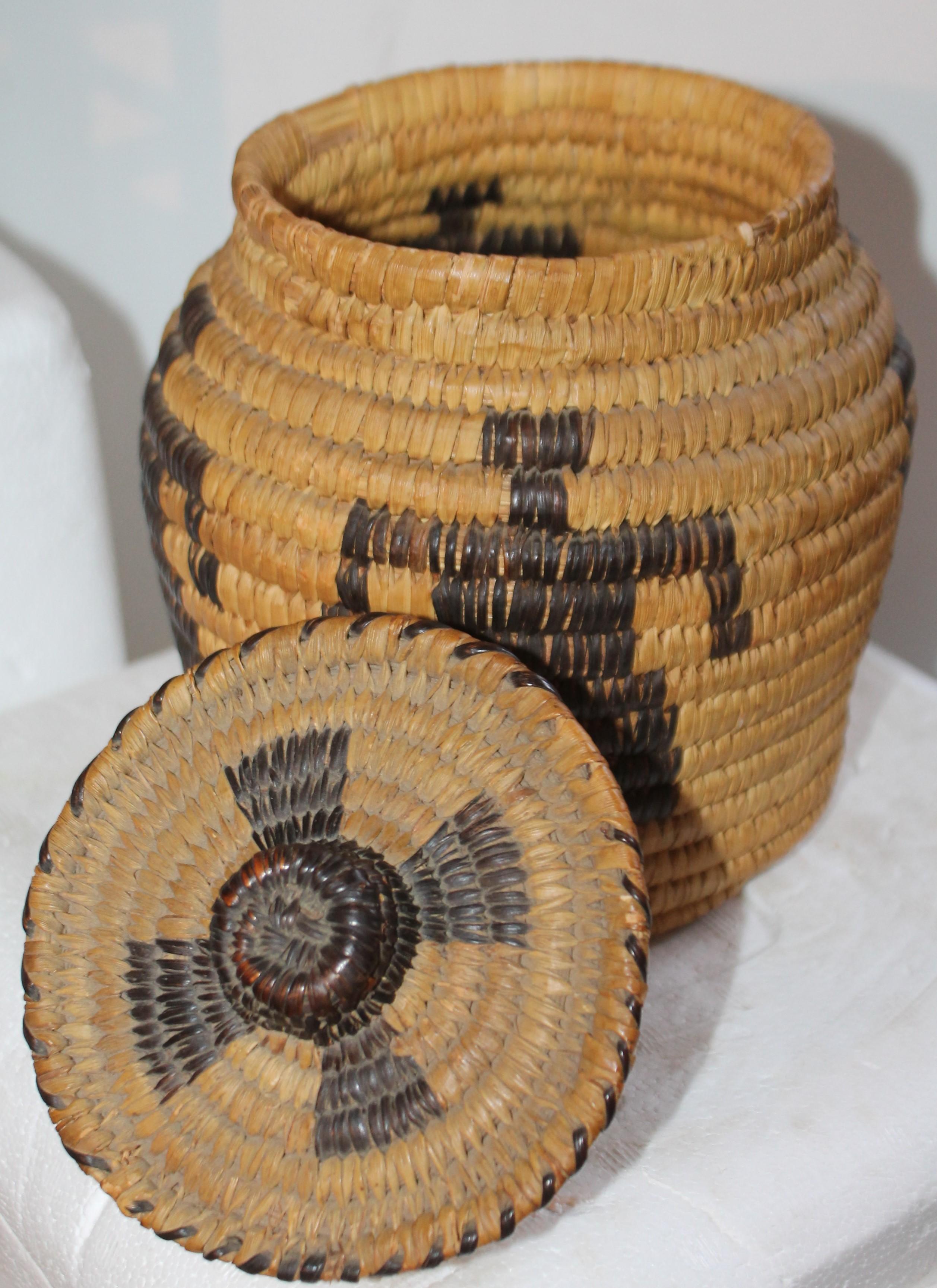 This fine American Indian Papago lidded basket in good condition and quite unusual dancers featured on the basket.
