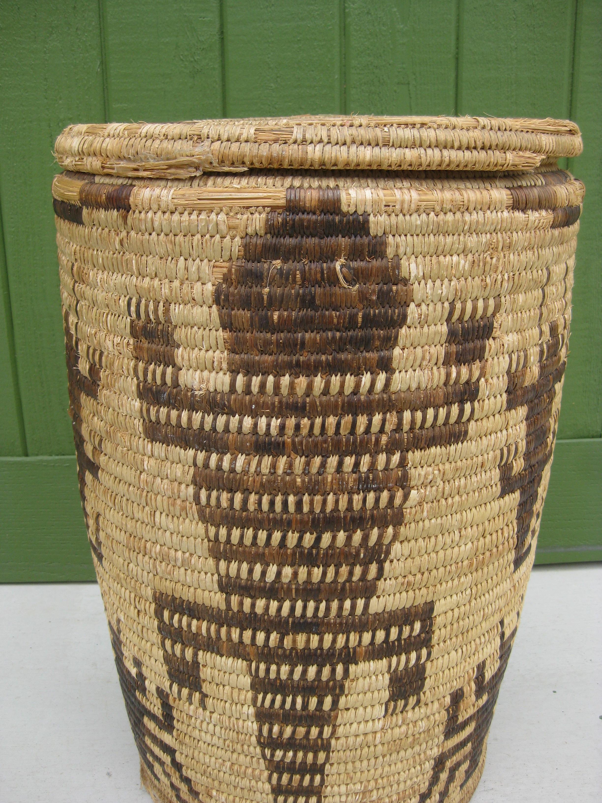 Wonderful vintage hand woven Papago Native American Indian pictorial lidded coil basket olla. Great form and design. Has wonderful figures around the basket. This is one of the largest olla's I have seen. It measures 22