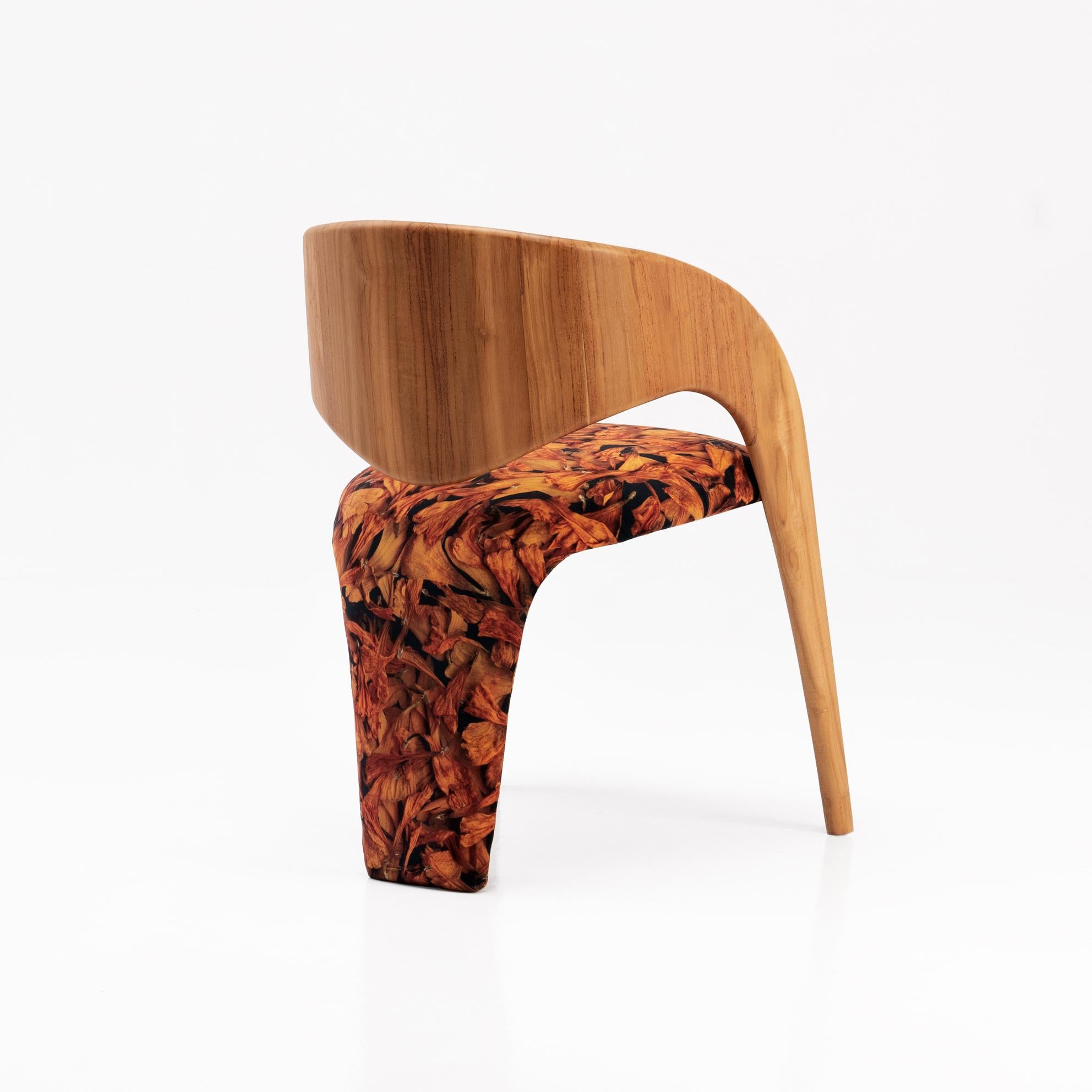 The 'Papaya Eater' chair takes inspiration from forms found in the animal kingdom. This living object is hand carved from solid Teak and upholstered in our ‘Earthly Delights’, from our 'Biophilia Dreamin' textile art collection.

This piece is made