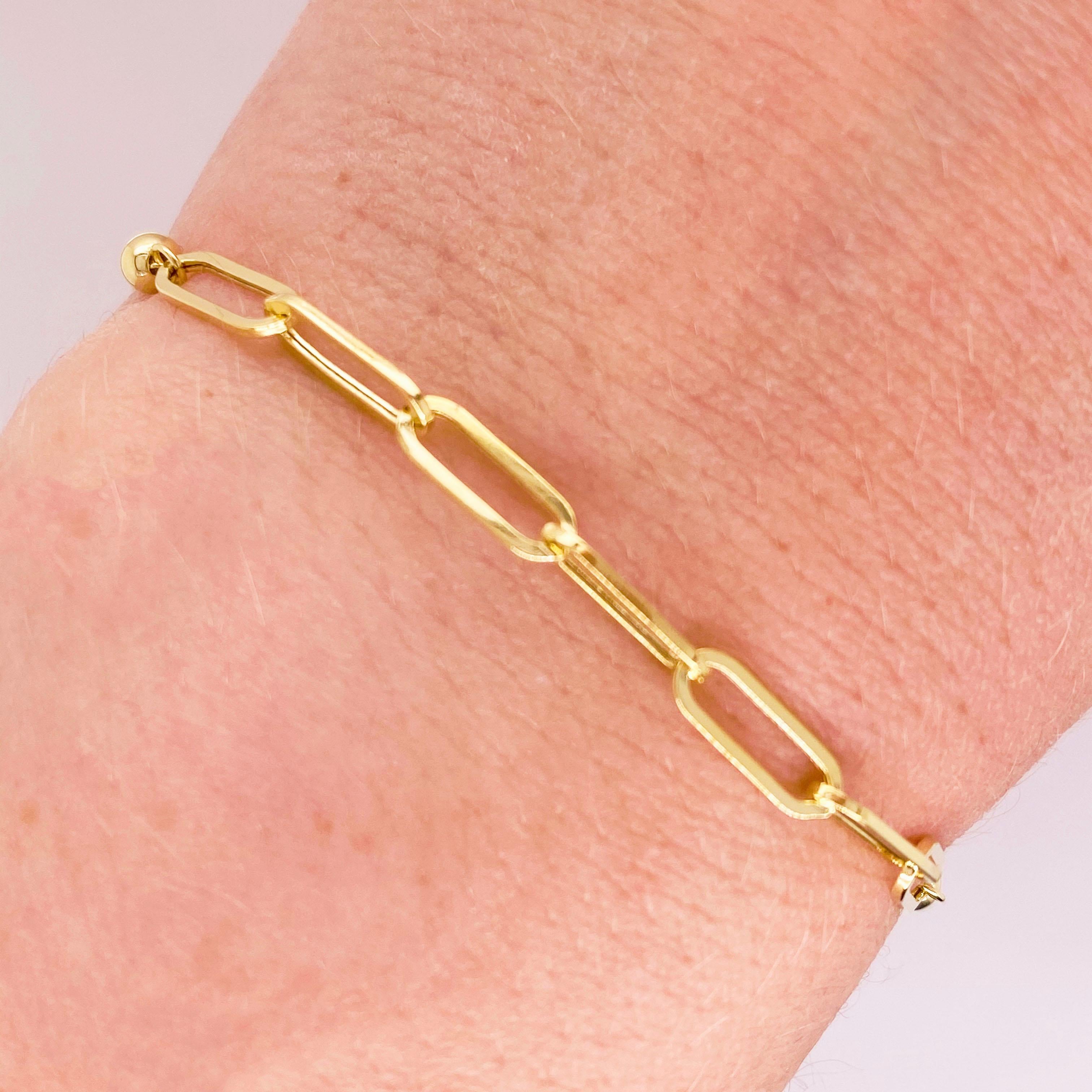 Paper clip chains are the hottest thing in 2020's jewelry fashion! This 14k yellow gold bracelet matches everything and is the perfect addition to any outfit, casual or formal. The bolo clasp on this bracelet allows you to wear it as snugly or