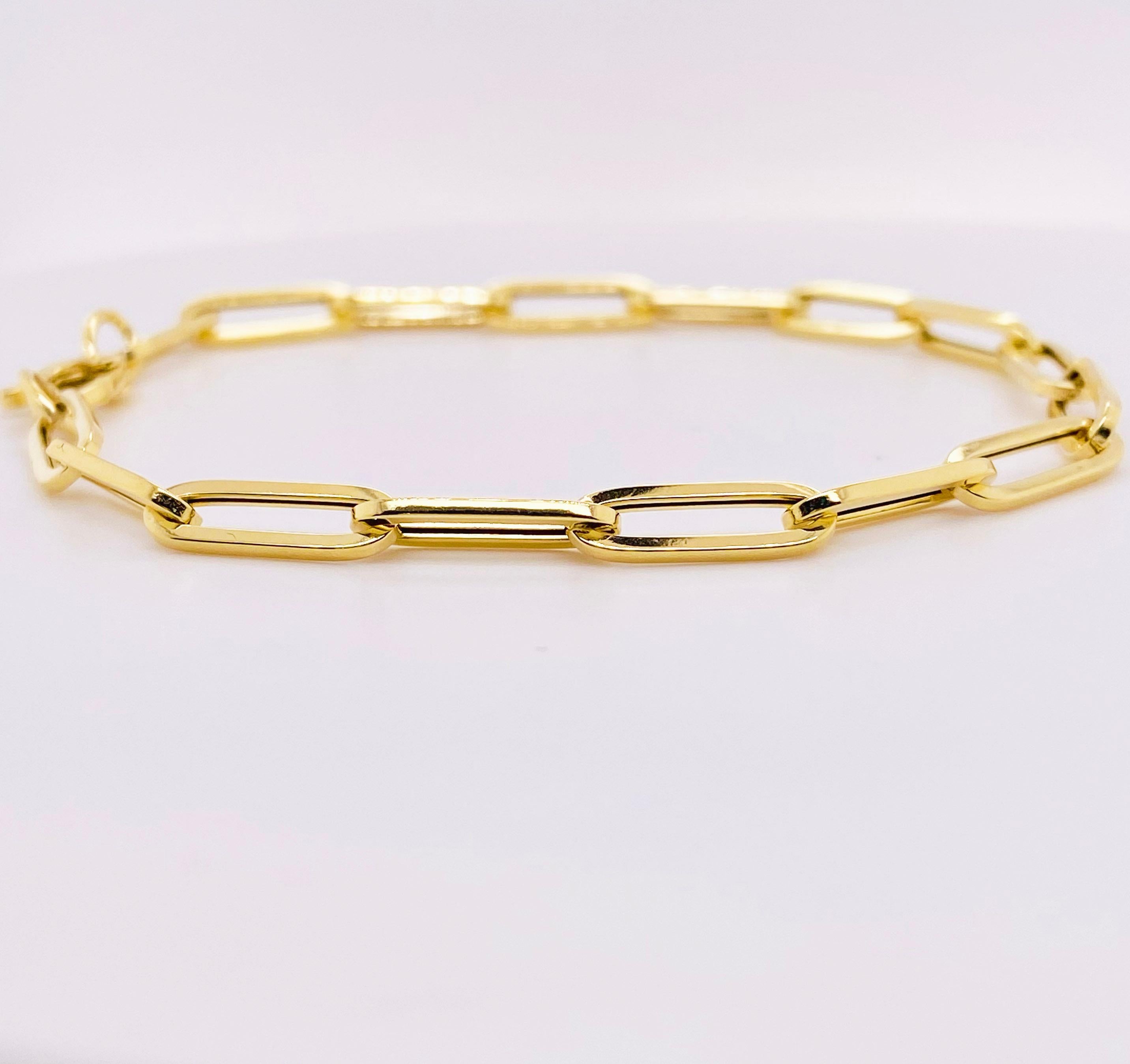 This paperclip bracelet is 2021 most popular designer bracelet. The bracelet is 4.4 millimeters wide and 7.5 inches long. It is perfect for a medium lady’s wrist or a small man’s wrist.  The rich 14 karat yellow gold is stunning! The bracelet weighs