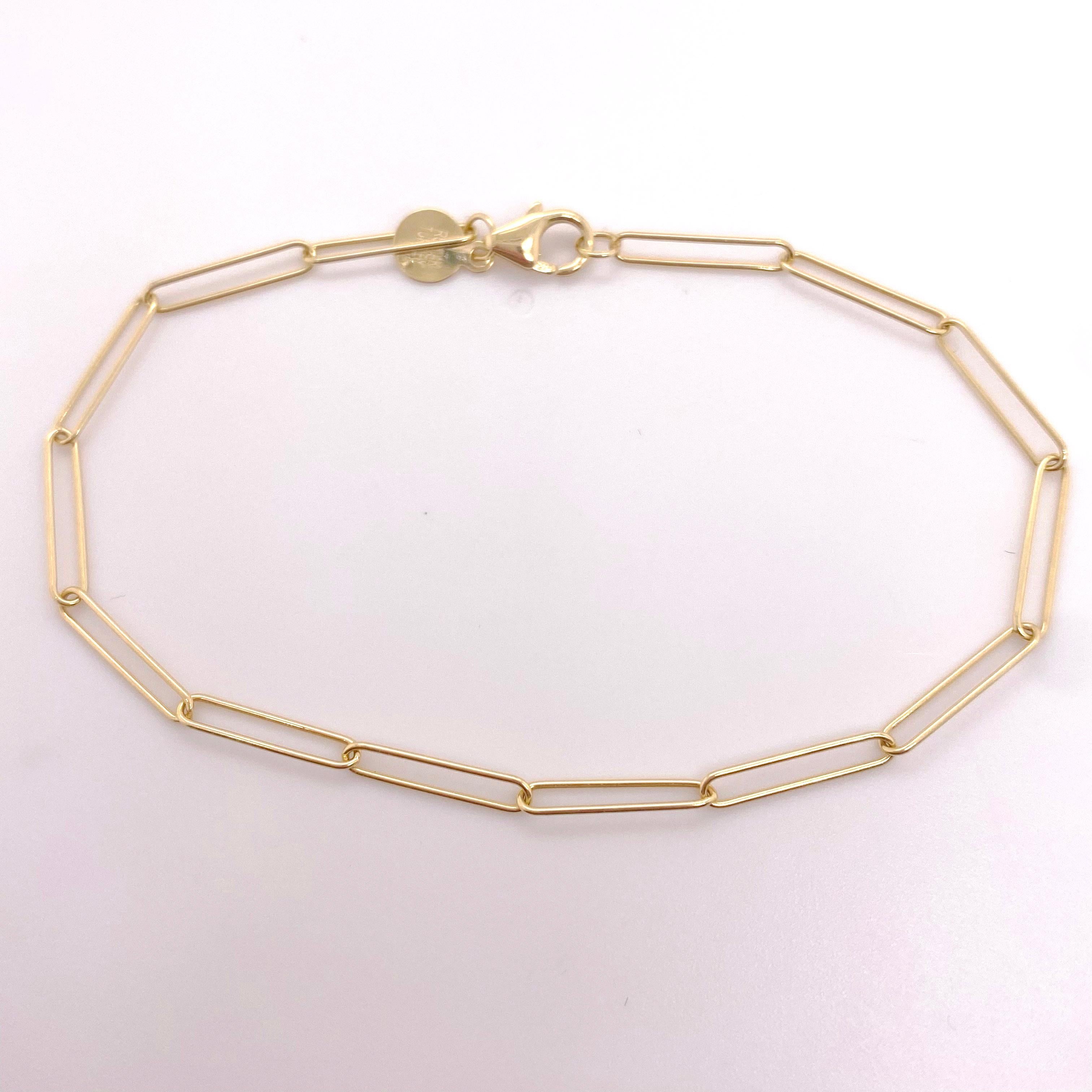 This paperclip bracelet is a slim minimalist beauty on your wrist everyday! Wear it alone or stacked with other bracelets! The strong gold wire that makes these long sleek links makes for a slightly different link than other paperclip chains that