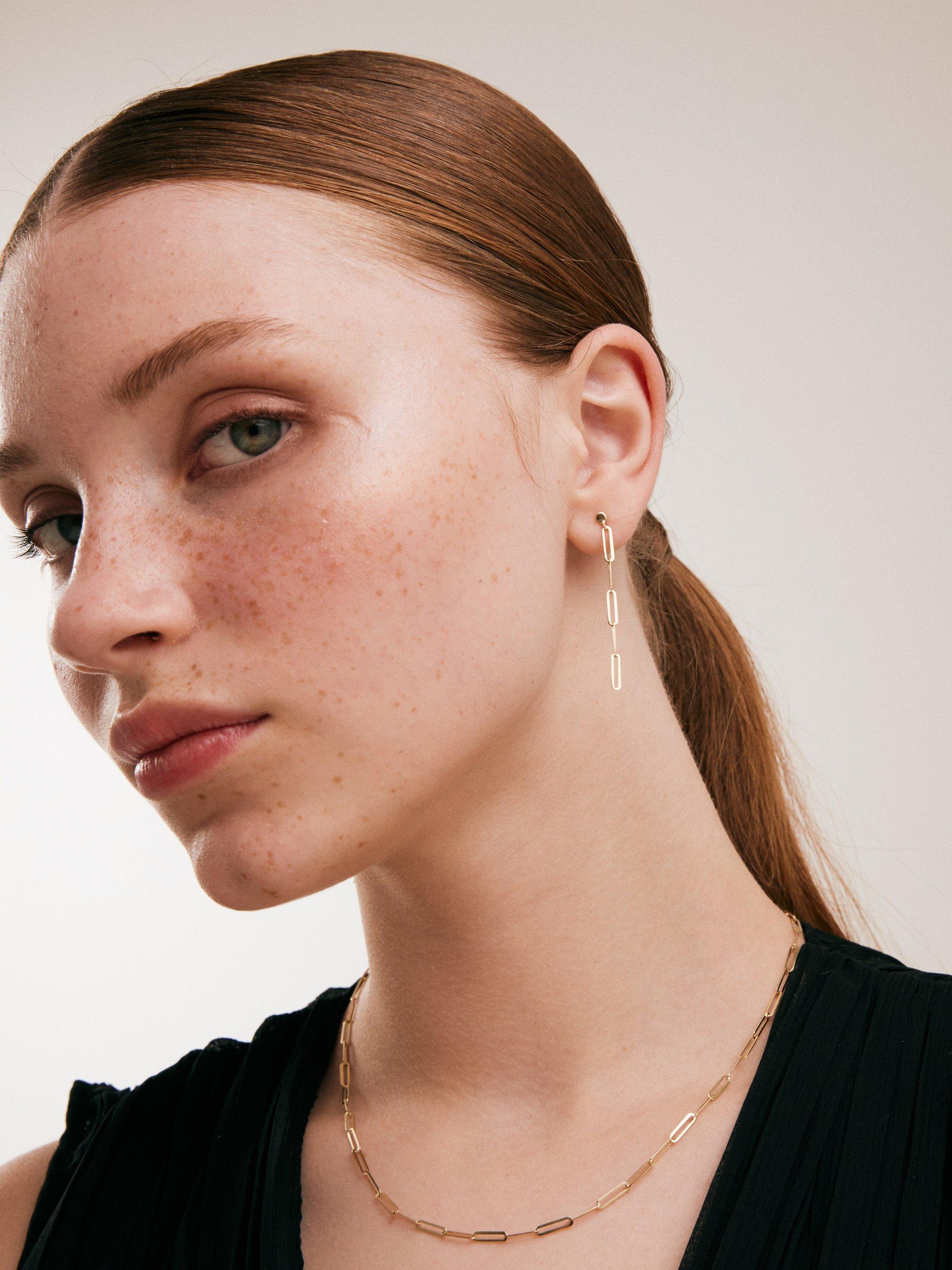 Introducing our Paper Clip Drop Earrings in 14K Solid Gold, a tribute to Orena Jewelry's unwavering dedication to impeccable craftsmanship. Each pair is meticulously handcrafted, emanating a captivating blend of modern allure and timeless