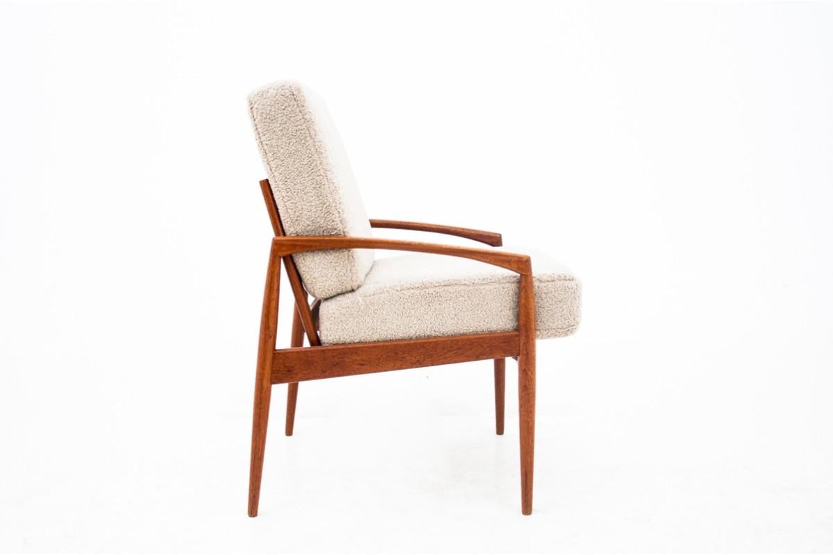 Paper Knife armchair by Kai Kristiansen, produced in Denmark in around 1950s. Teak frame preserved in very good condition, with original stamp at the back. Custom made boucle cushions in beige color.

Dimensions: height: 98 cm, seat height: 54 cm,