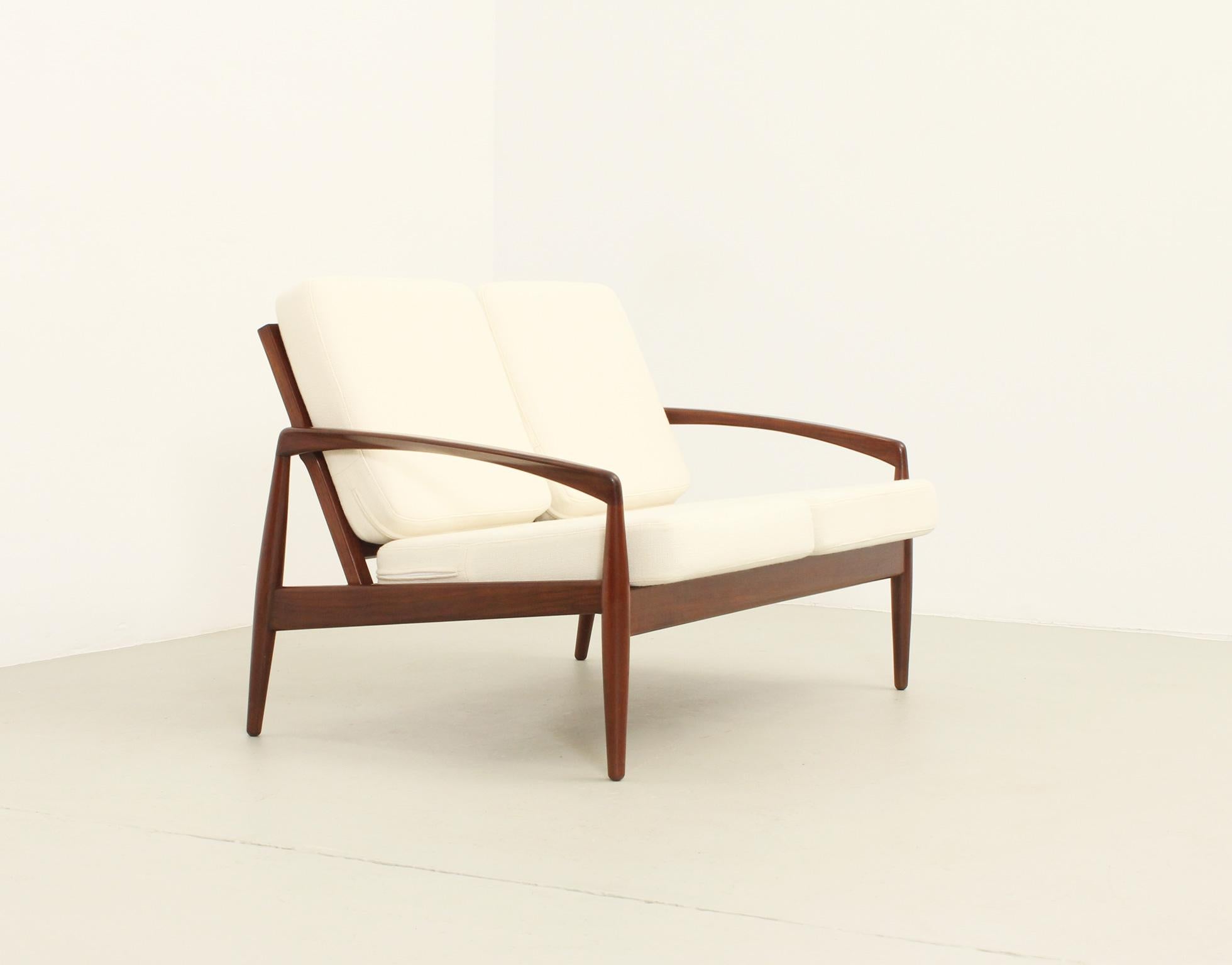 Two seater Paper Knife sofa designed in 1956 by Kai Kristiansen for Magnus Olesen, Denmark. Teak frame upholstered with new wool fabric from Kvadrat.