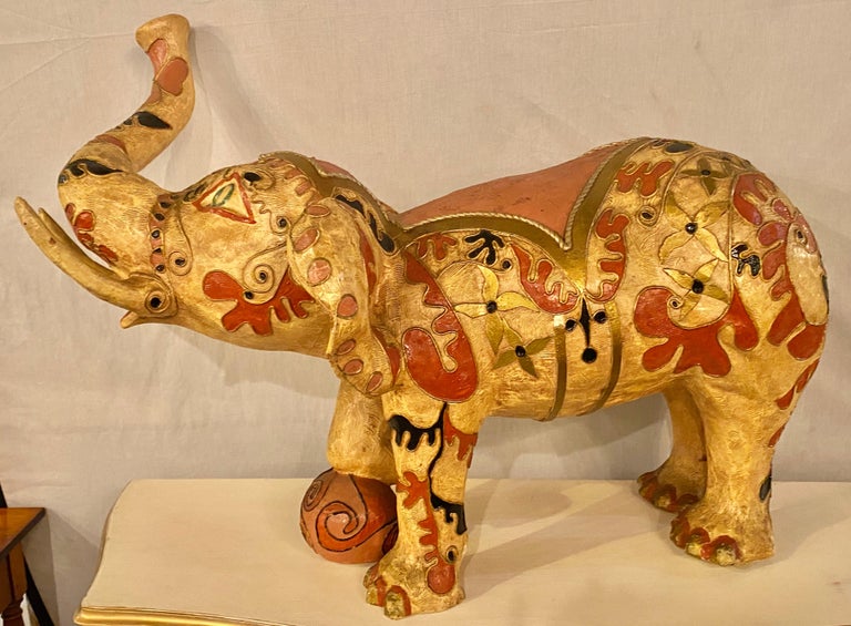 Paper mâché hand painted circus elephant with ball. A large and impressive figure of a circus elephant.