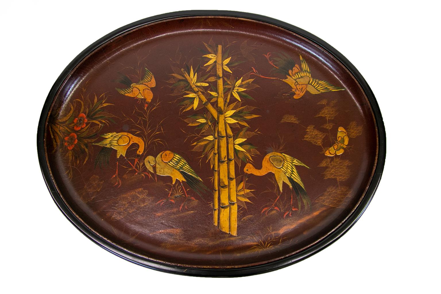 Paper mâché lacquer tray table has bamboo and bird motifs. The stand was recently custom built to fit the tray.
   