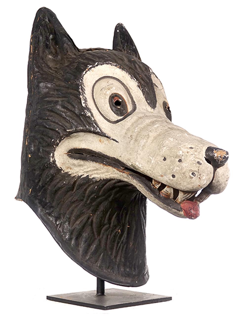 This is a Halloween wolf character helmet. I'm guessing it's 1920s and very well done. The custom made stand is included. I've been told that it could be early Disney and it really has that color and feel. When we found it that was my first thought.