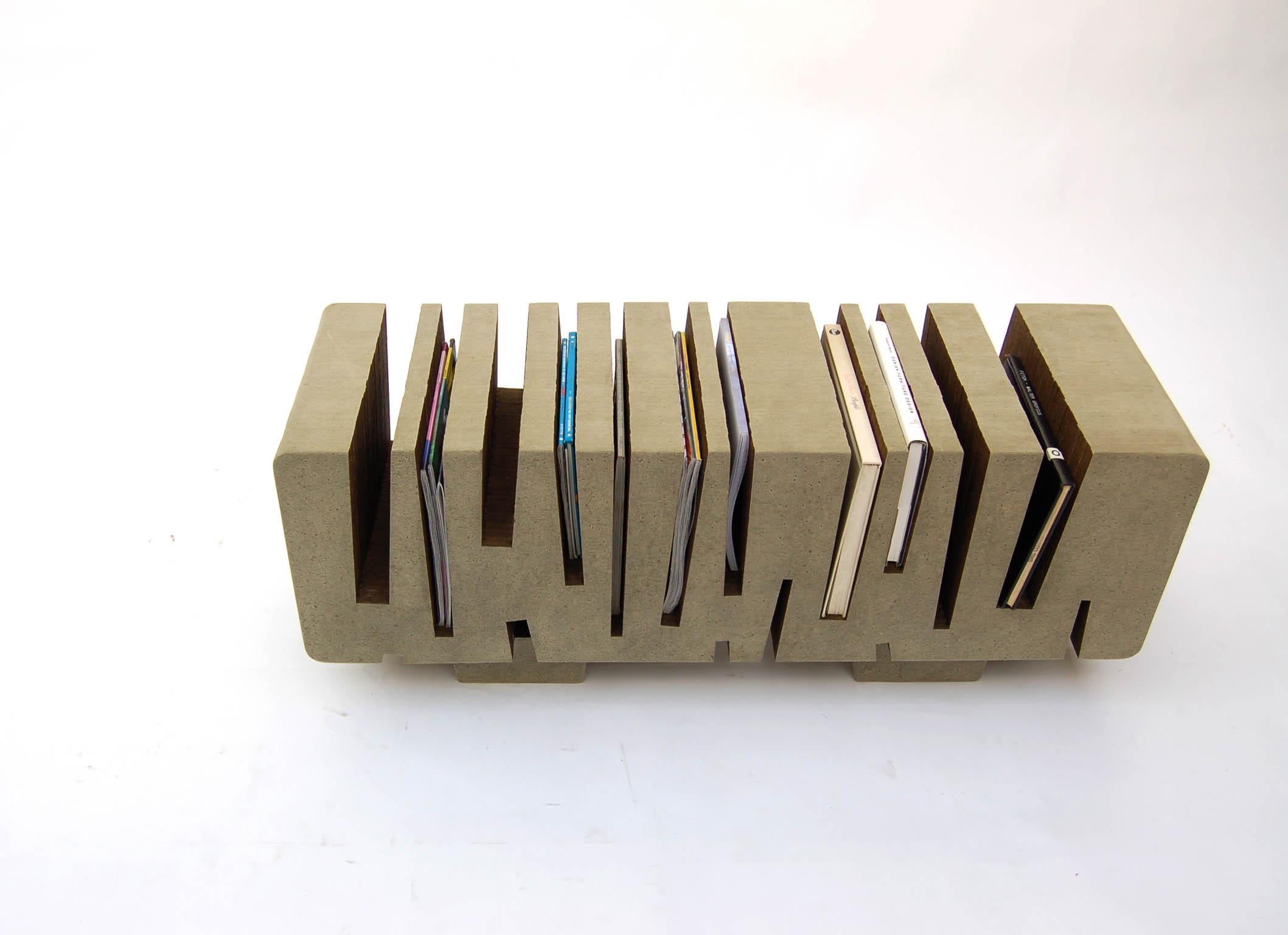 Coffee tables, benches and side tables made from stacking layers of recycled paper board. Cuts in the assembled paper blocks hold reading materials close at hand. The paper series explores the aesthetic possibilities of the new, old and re-usable.
