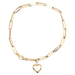 Pulsera sujetapapeles con charm de oro mini corazón de nácar blanco