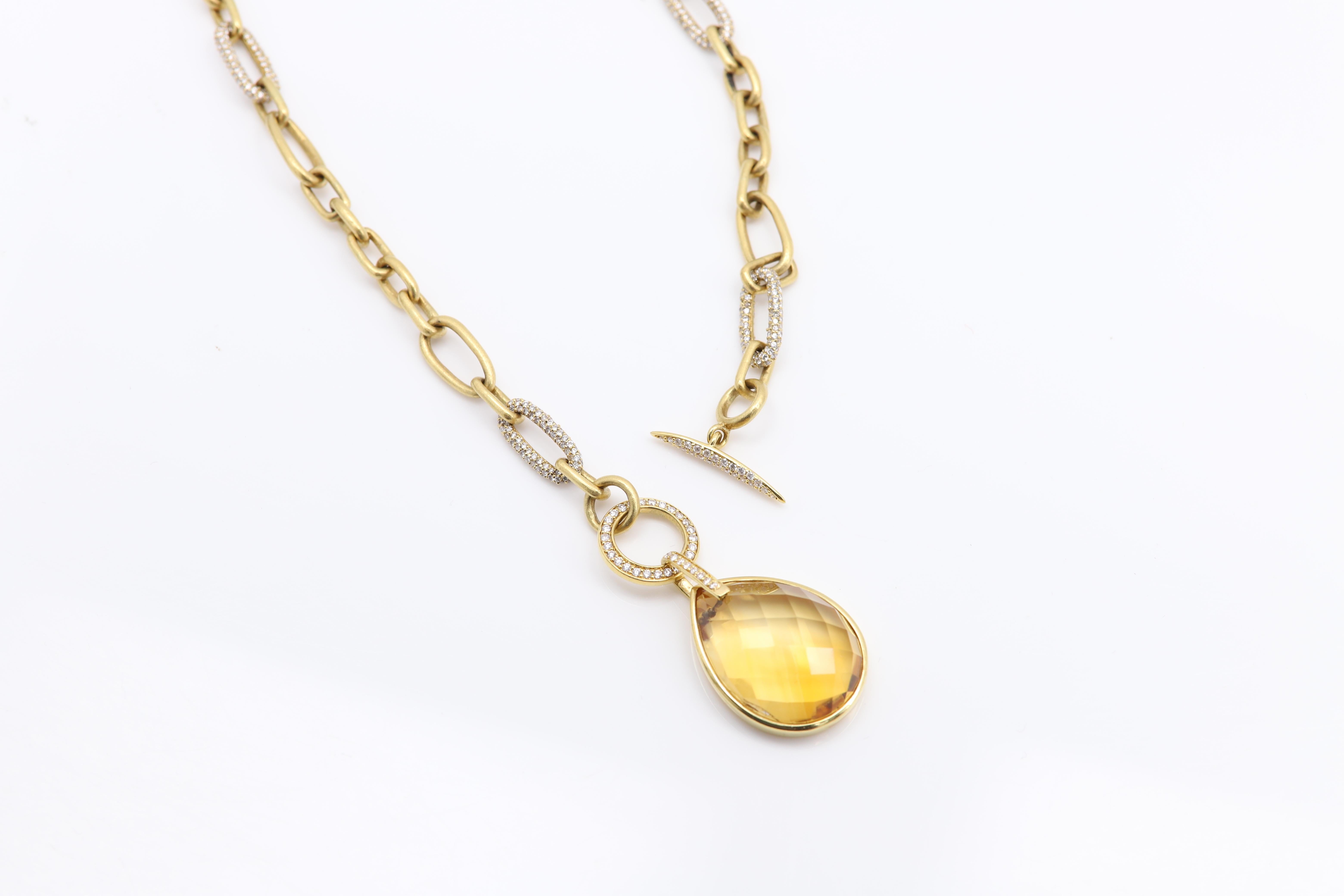 Unique Paperclip style chain with diamond links and center large Yellow Citrine Gemstone
18k Yellow Gold total 51 grams
Chain Length 16.5' inch
Center has a trendy toggle Lock
Center Citrine size approx  26 x 19 mm Pear shape
Average Link size