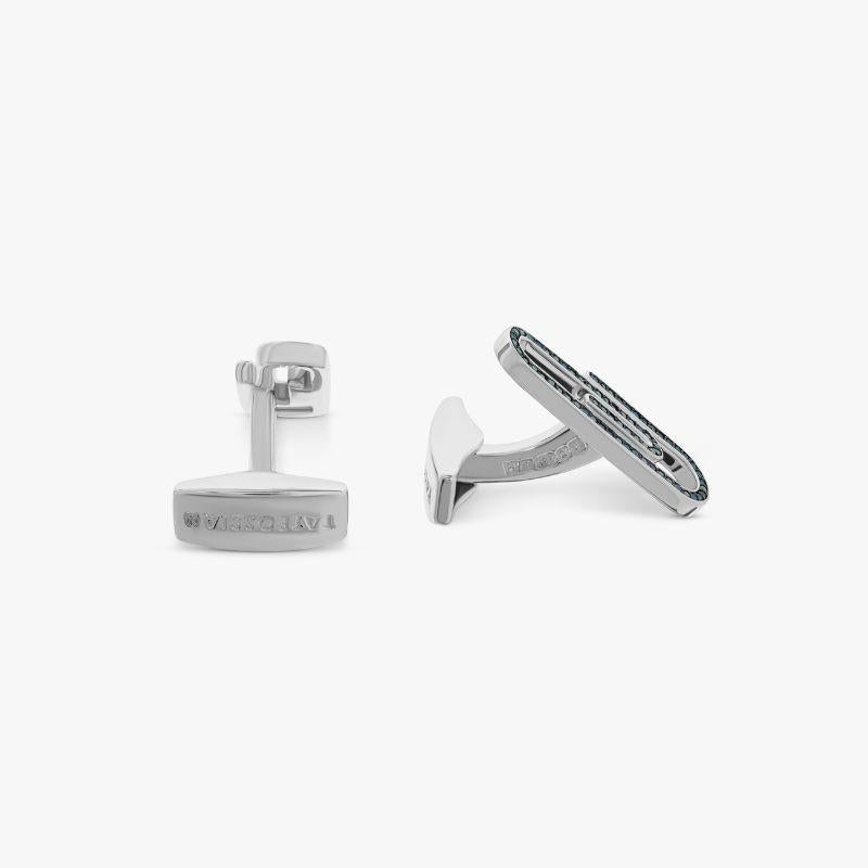 Paperclip Cufflinks with Blue Diamond in Sterling Silver

Quirky and unique, these match stick cufflinks are sure to spark up a conversation. The sterling silver base is adorned with 138 pavé blue diamonds (0.41ct) for a luxurious, sparkling finish.