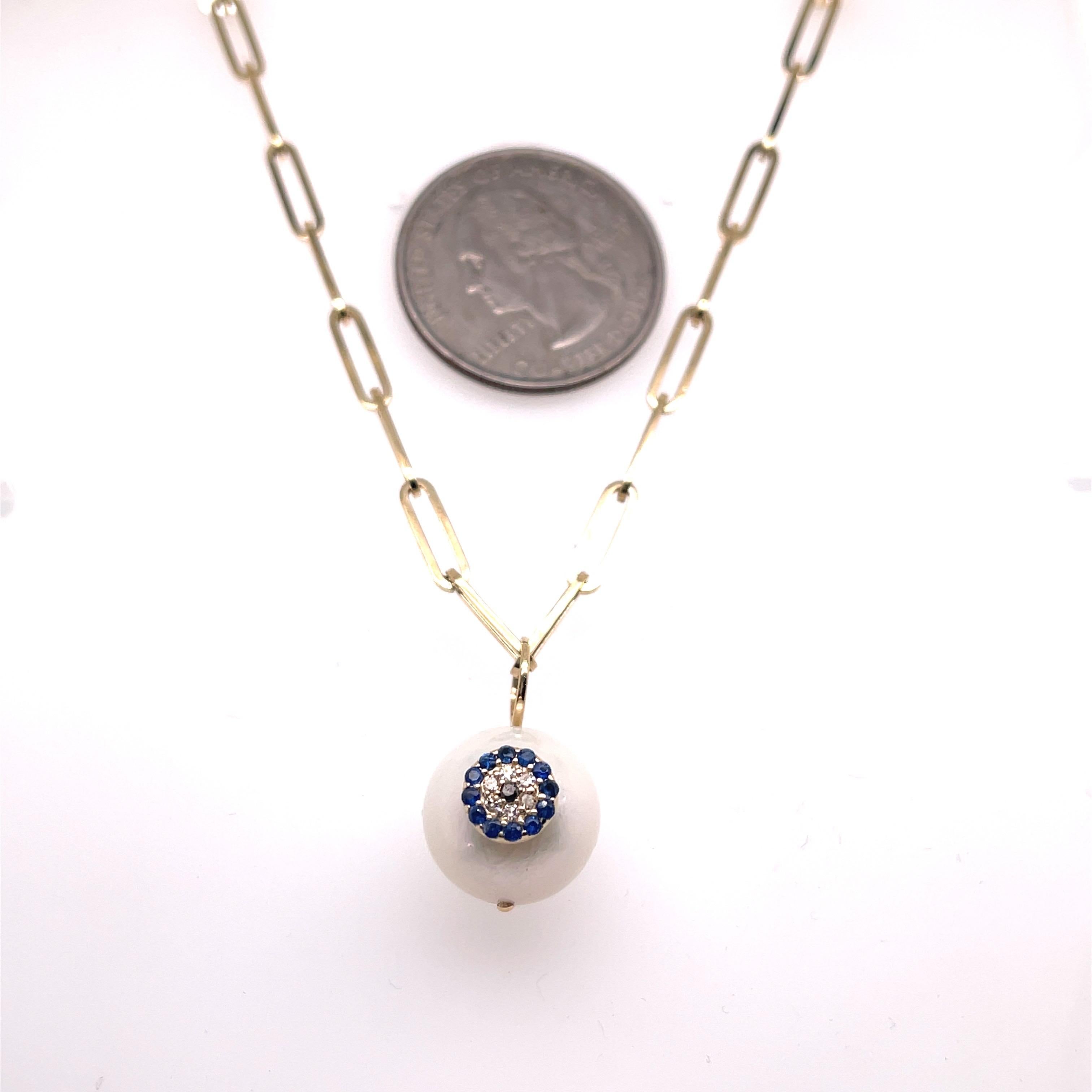 Paper link Necklace 2.80 g.
Pearl charm with white and blue sapphire