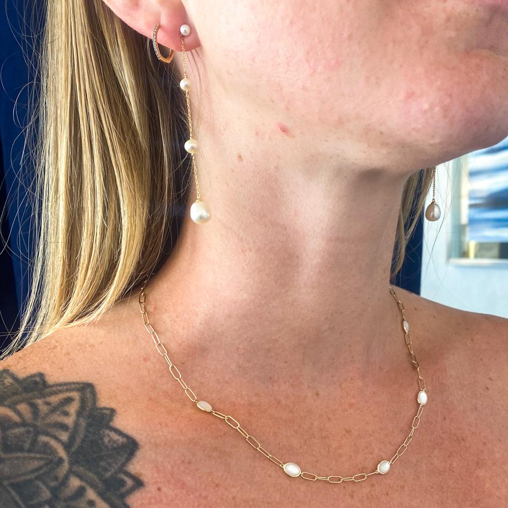 Add a graceful layer to your jewelry collection with this classy and versatile yellow gold and mother-of-pearl (MOP) station necklace. This stylish necklace is a perfect gift to mark a graduation, anniversary, birth, or important milestone! Gold