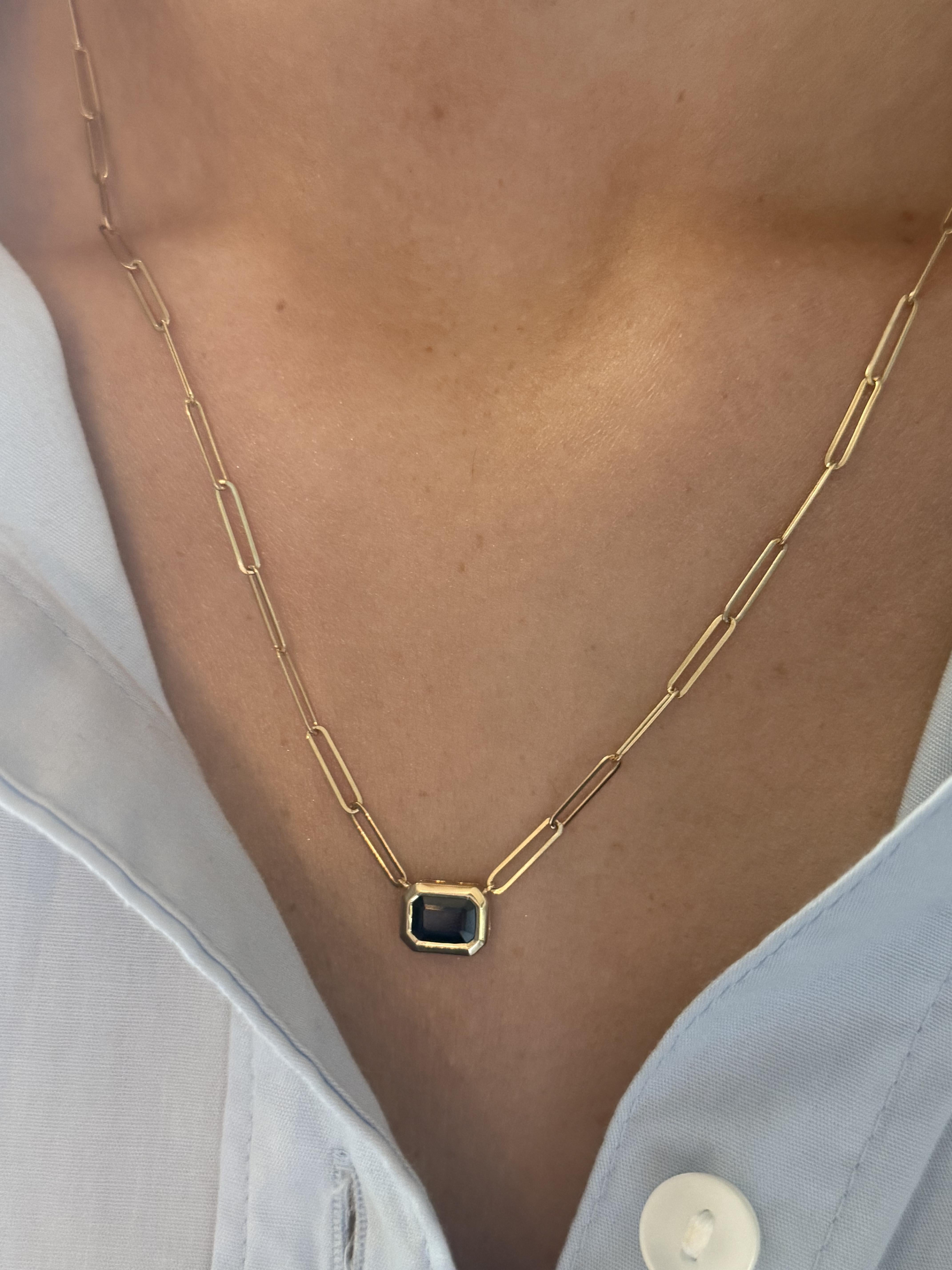 We are loving these paperclip necklaces!!

Necklace Details
Material: 14K Yellow Gold
Chain Width: 2.4mm
Weight: 4.2 Grams
Length: 18 1/4 Inches
Can Be Shortened Upon Request

Accented by the following gemstone
1 - 7mm X 5mm Emerald Cut Blue