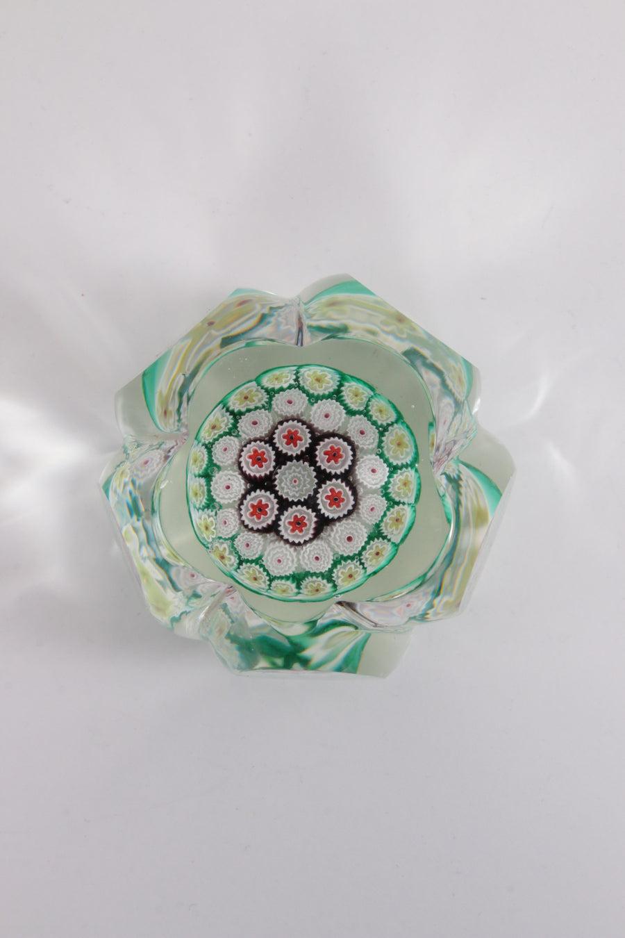 Paperweight Flower Model Murano Italy, 1960

A paperweight is an object that can be placed on a desk on top of papers to prevent them from blowing away. This goes back a long way, in Egypt they already used paperweight.

The word comes from French