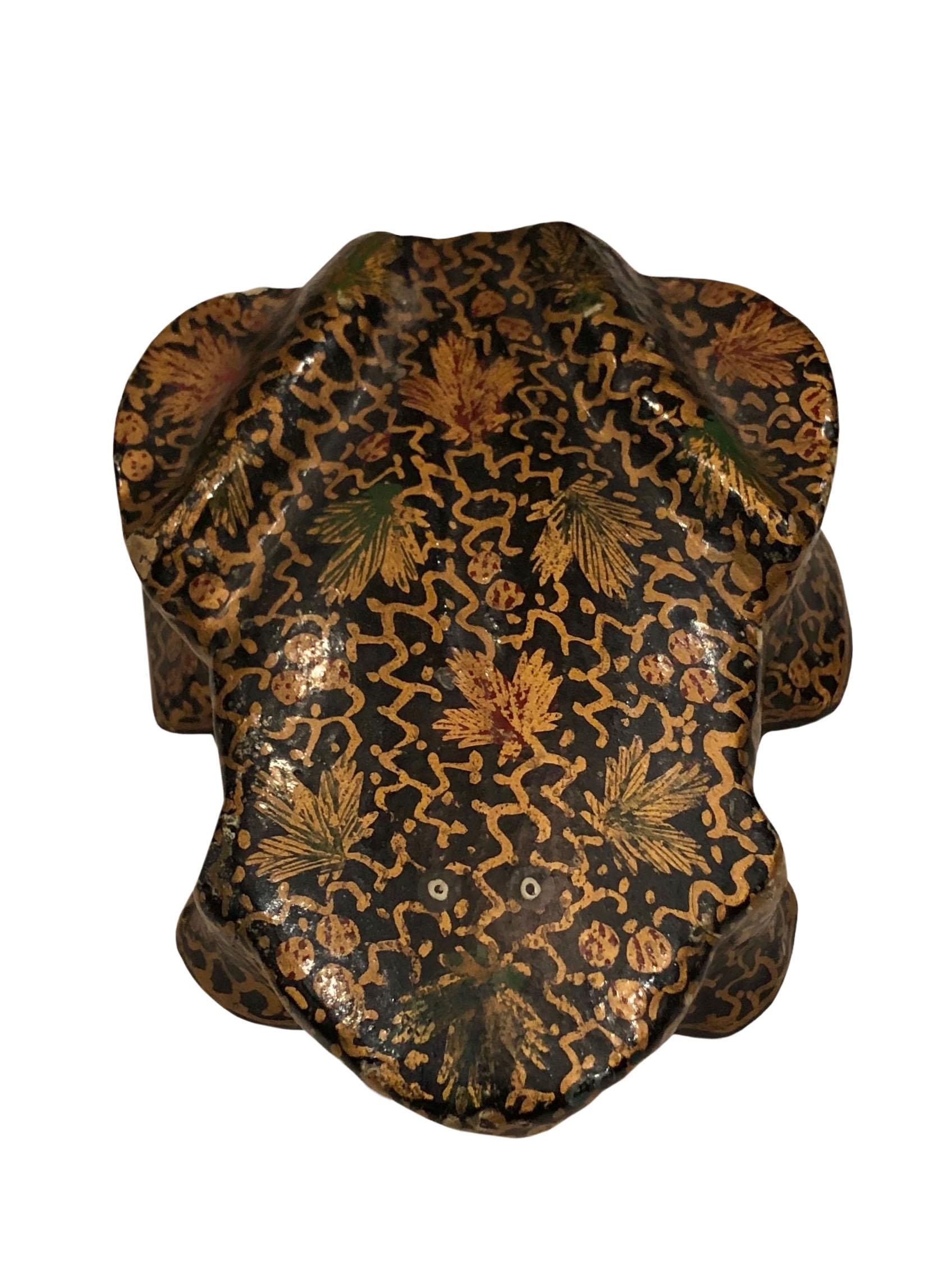 A vintage hand painted papier mâché box in the shape of a frog from Kashmir India. Gold and black, circa,1960s.