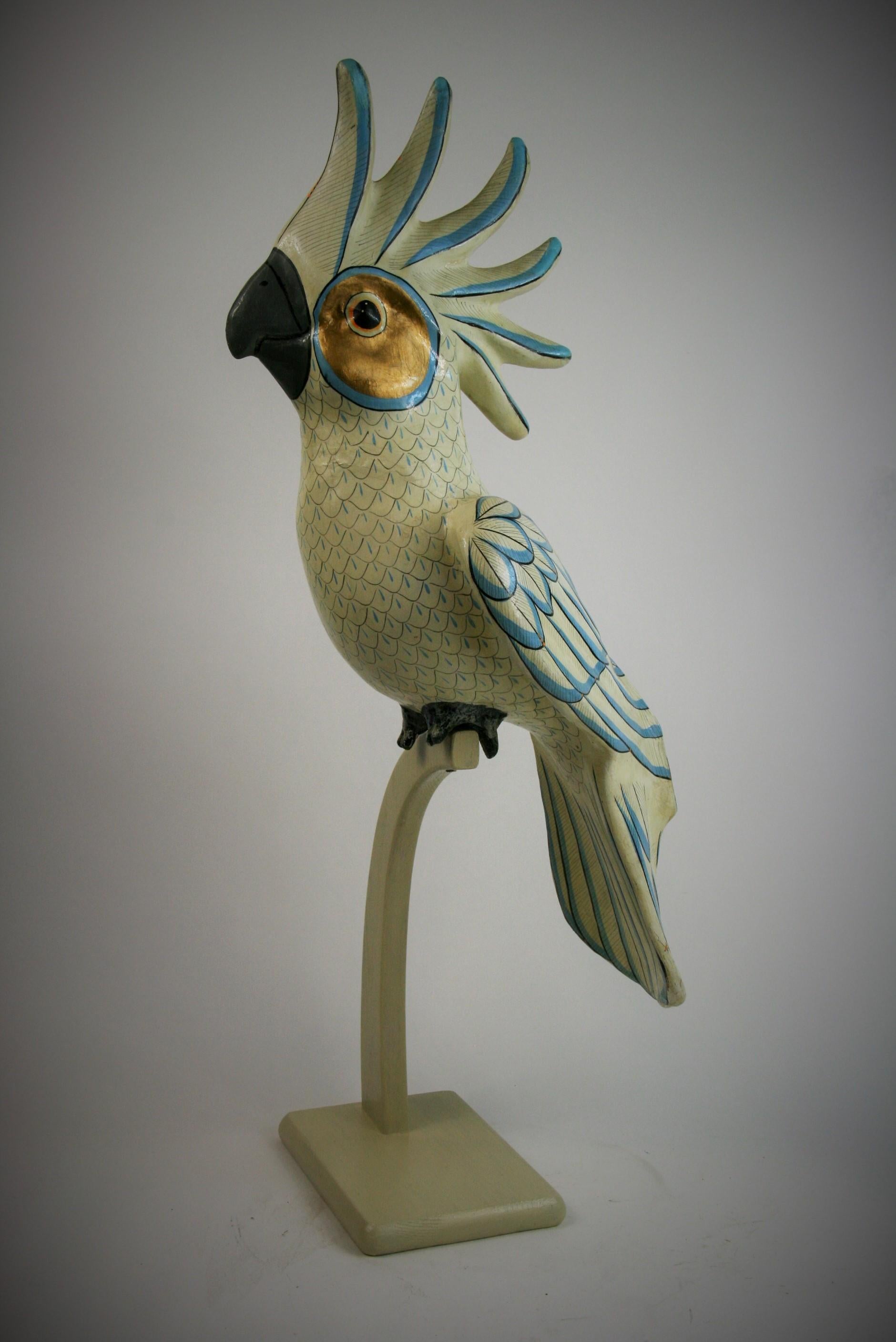 8-287 papier mâché oversized cockatoo sculpture set on a custom wood perch from the workshop of Mexican artist
Sergio Bustamante, circa 1970.