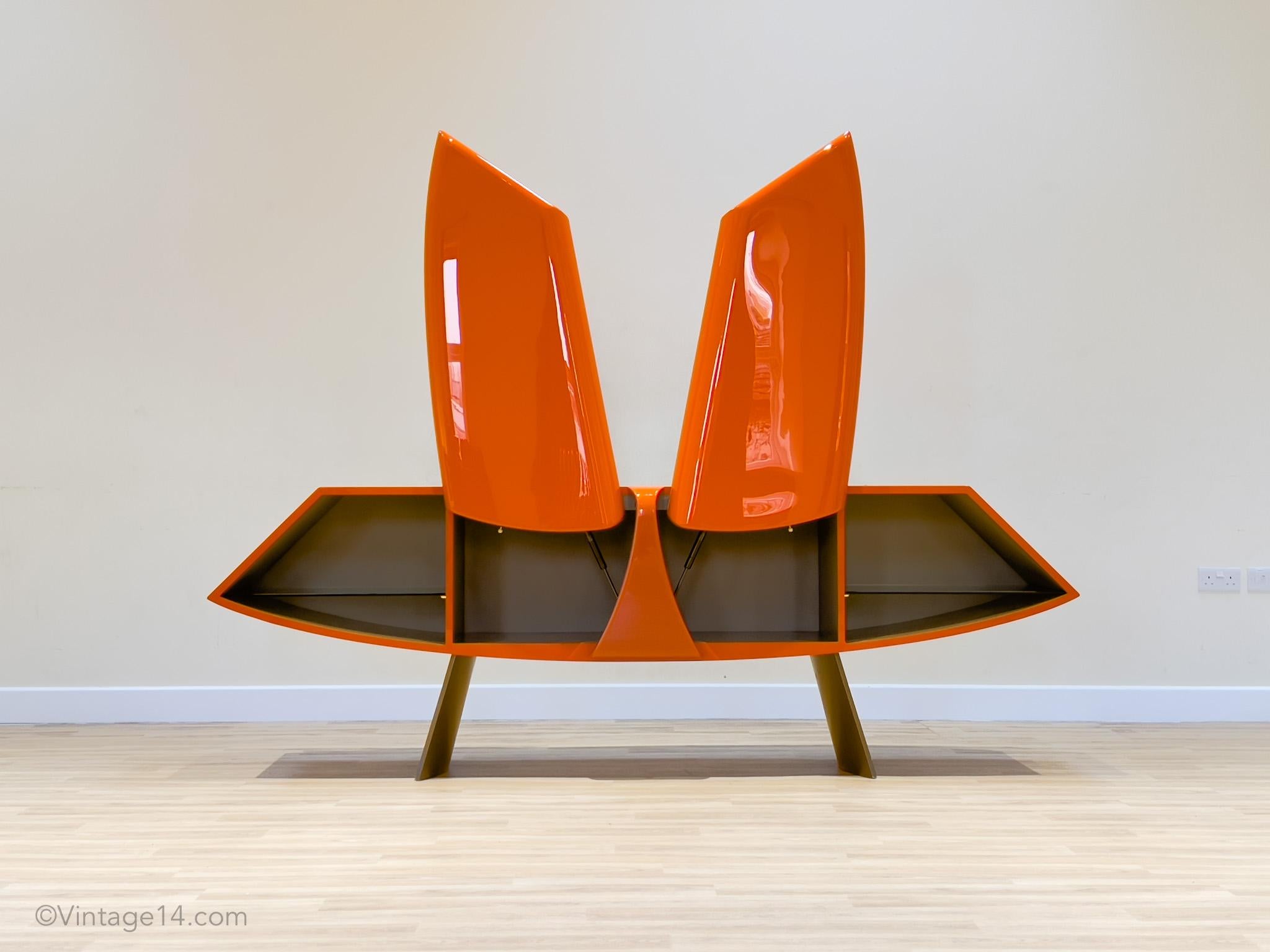 Sideboard by René Bouchara for Roche Bobbois. number 92/400

Born in Paris and educated in New York, René Bouchara imagined a sideboard which evoked images of the grace of a butterfly and at the same time the elegance of a sports car.‎ The glossy