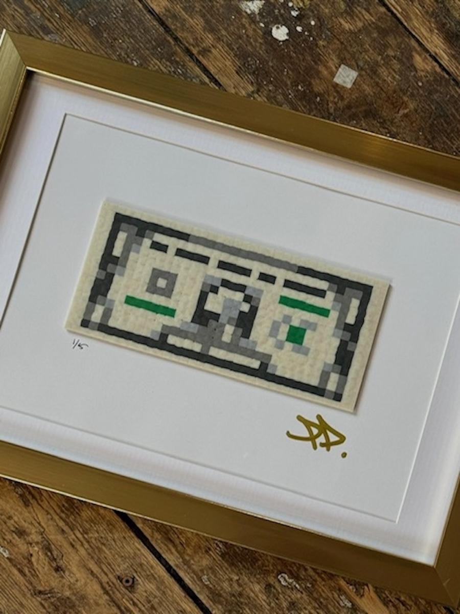 3-D hand made artwork using Perler beads and mixed media in a gold frame

the artist lives and works out of Sweden and is represented by Krause Gallery in NYC