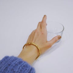 Papua Bracelet is handcrafted from 24ct gold-plated bronze
