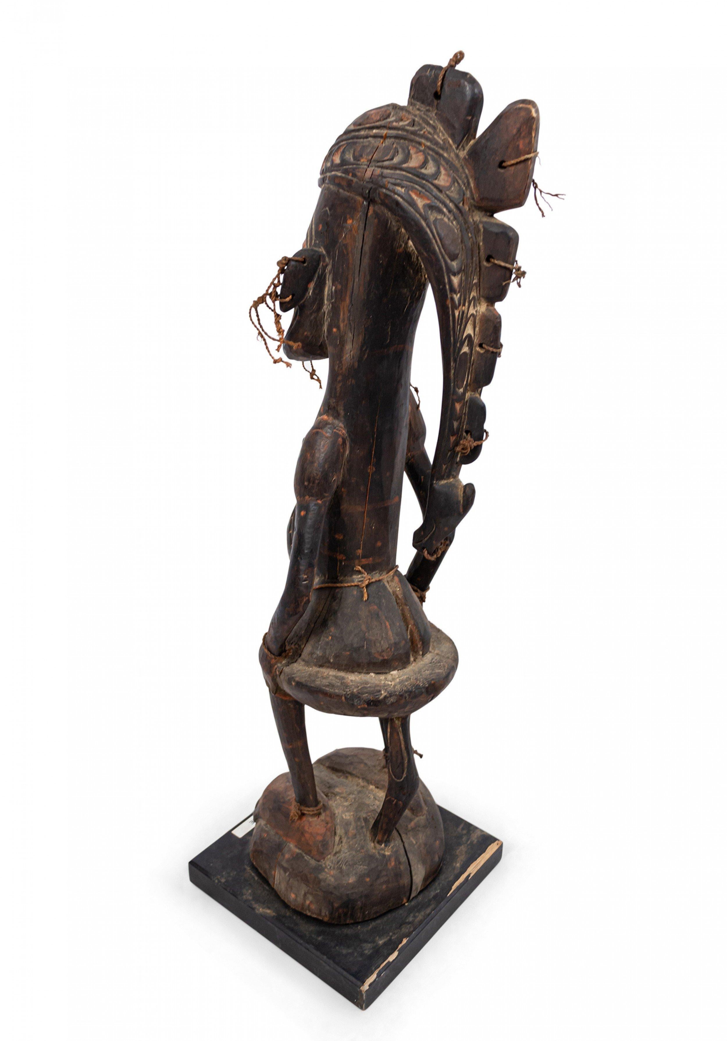 Tribal Papua New Guinean Polychromed Carved Figure For Sale