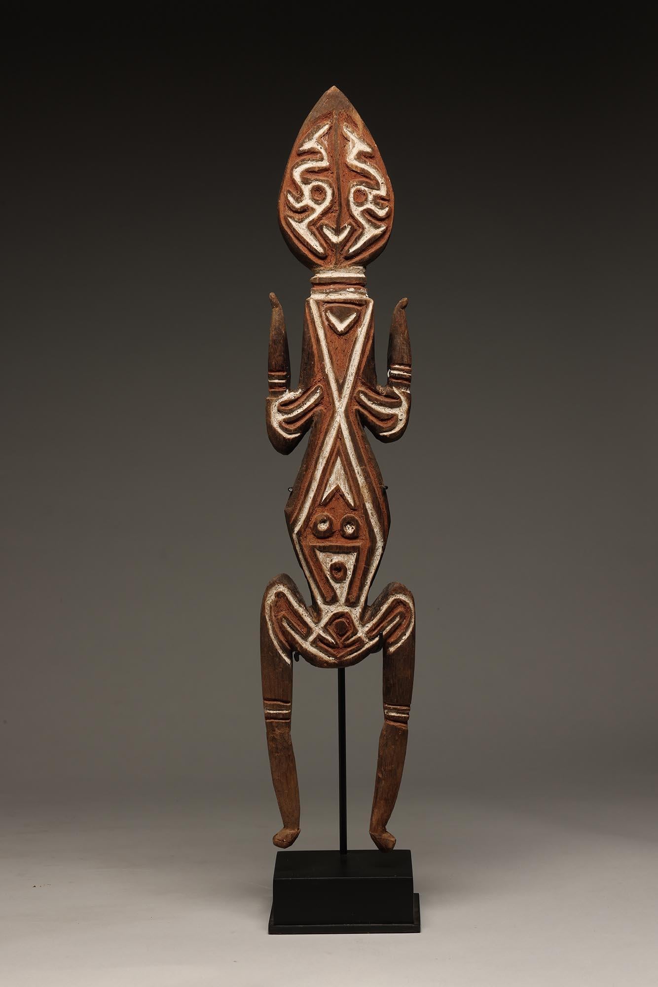 Papua New Guinea standing Bioma figure with raised designs, stylized classic face, and additional face in stomach.  Mounted on custom metal and wood base.  

Created mid 20th century or earlier.
Provenance: From early CA USA collection, previously