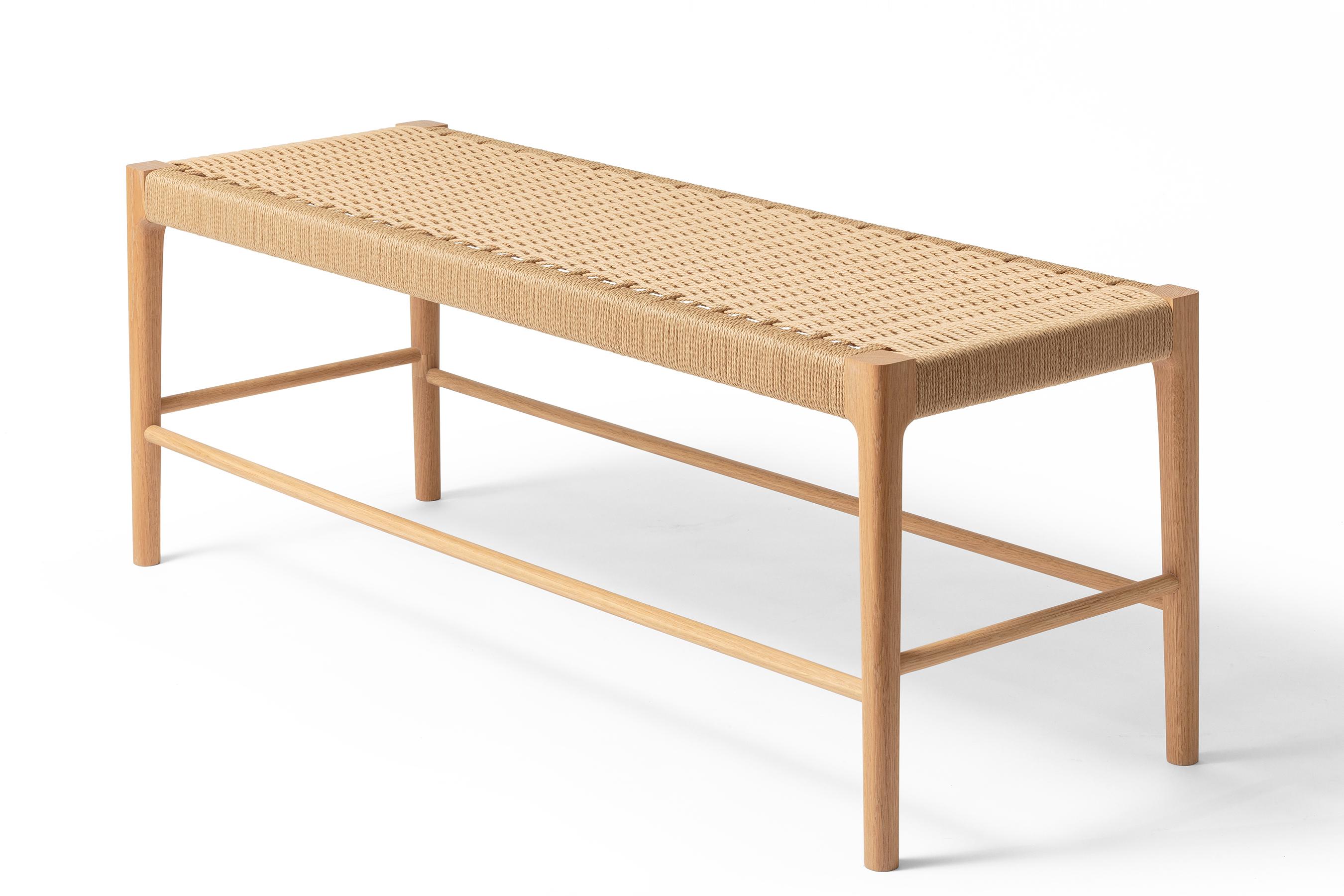 Featuring a mortice and tenon frame, custom doweling and a handwoven seat, the Papyri Bench is artisan-crafted from recyclable paper cord, and North American White Oak.

The seat features a continuous run of Danish paper cord woven around 