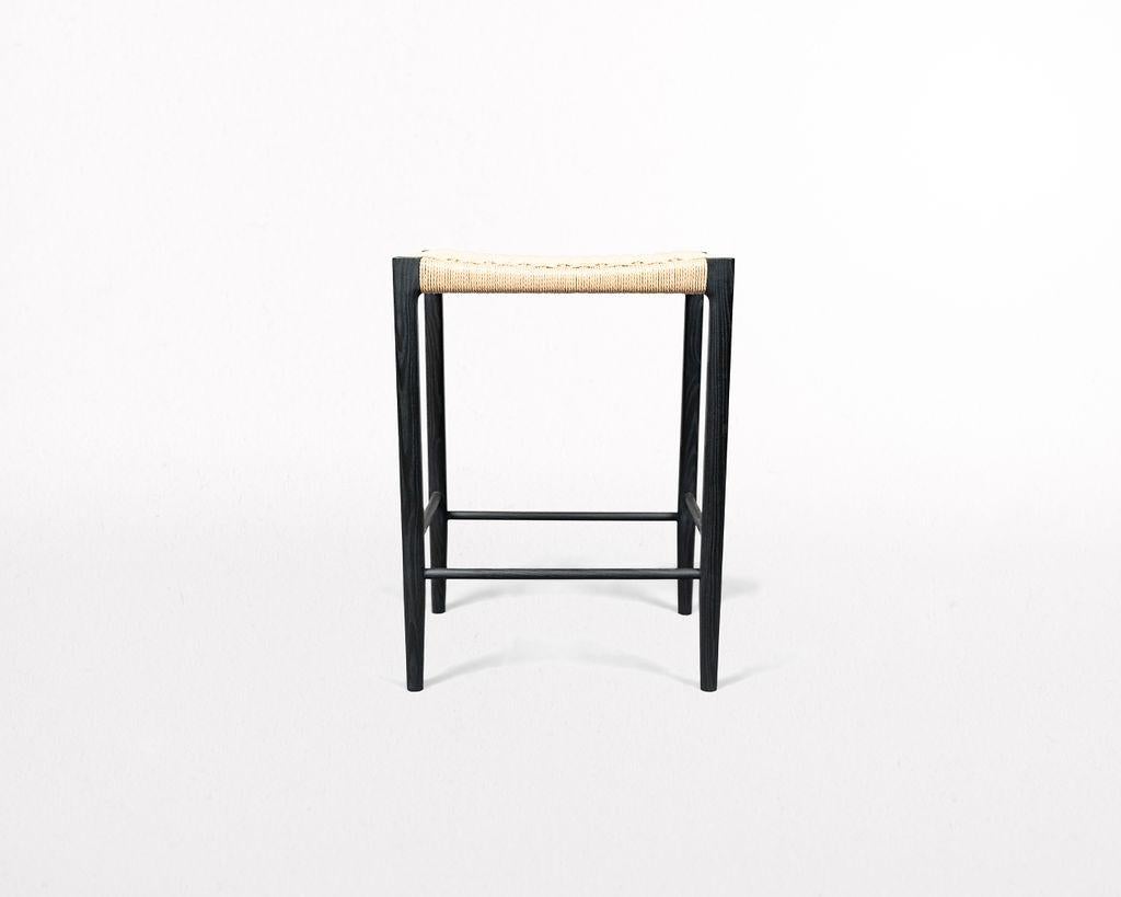 Featuring a mortice and tenon frame and handwoven seat, the Papyri Stool is artisan-crafted from recyclable paper cord, and sustainably harvested ash.

The seat features a continuous run of Danish paper cord woven around 