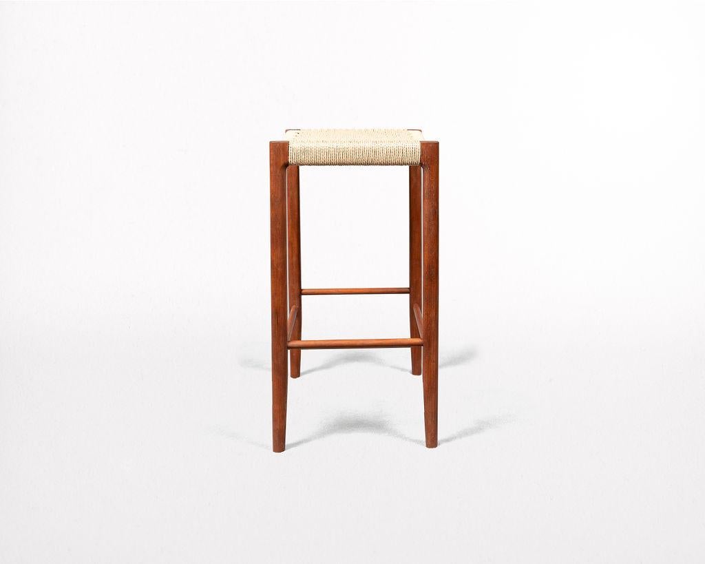 Featuring a mortice and tenon frame and handwoven seat, the Papyri Stool is artisan-crafted from recyclable paper cord, and sustainably harvested cherry.

The seat features a continuous run of Danish paper cord woven around 