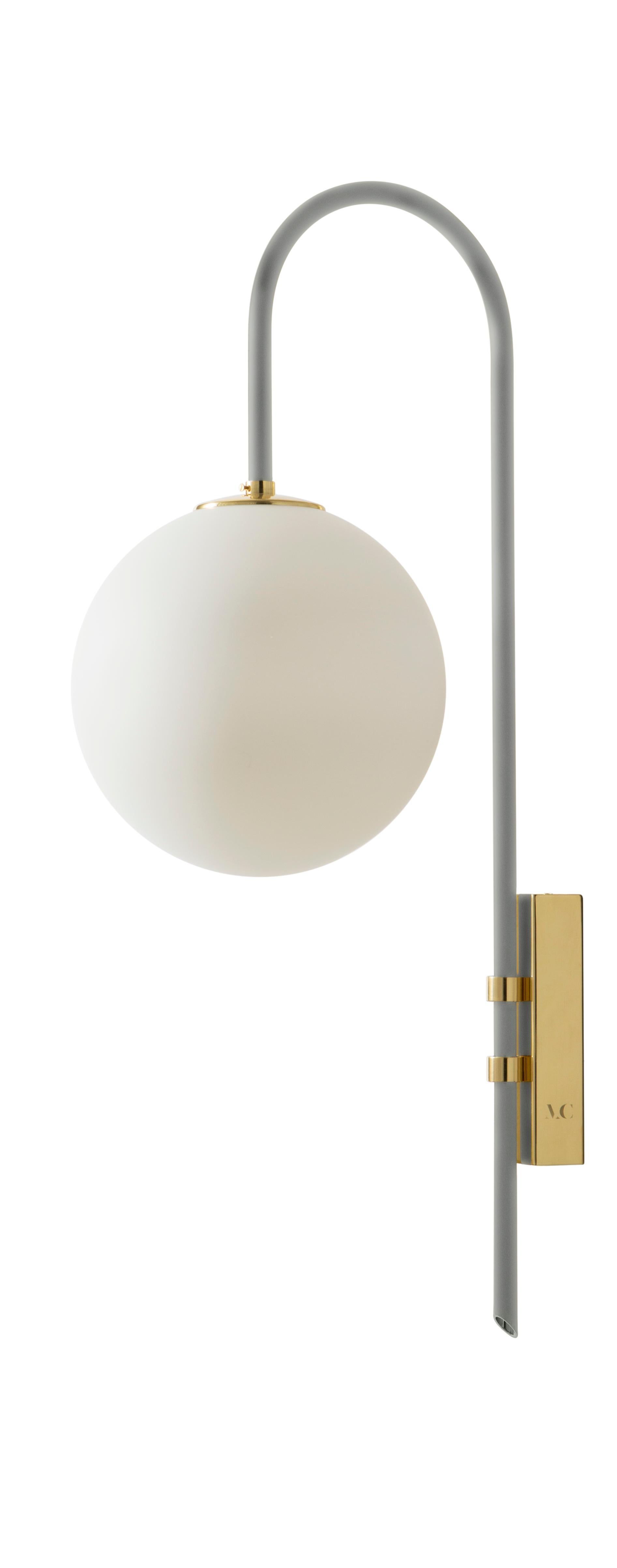 Papyrus brass wall lamp 06 by Magic Circus Editions.
Dimensions: H 77 x W 25 x D 36.5 cm.
Materials: Smooth brass, mouth blown glass.
Sphere dimensions: 25 cm.

Available finishes: brass, nickel.
All our lamps can be wired according to each