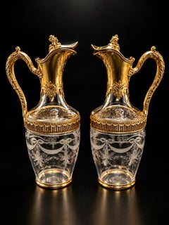 Par de jarras y vasitos estilo Luis XVI de cristal tallado y plata vermeil