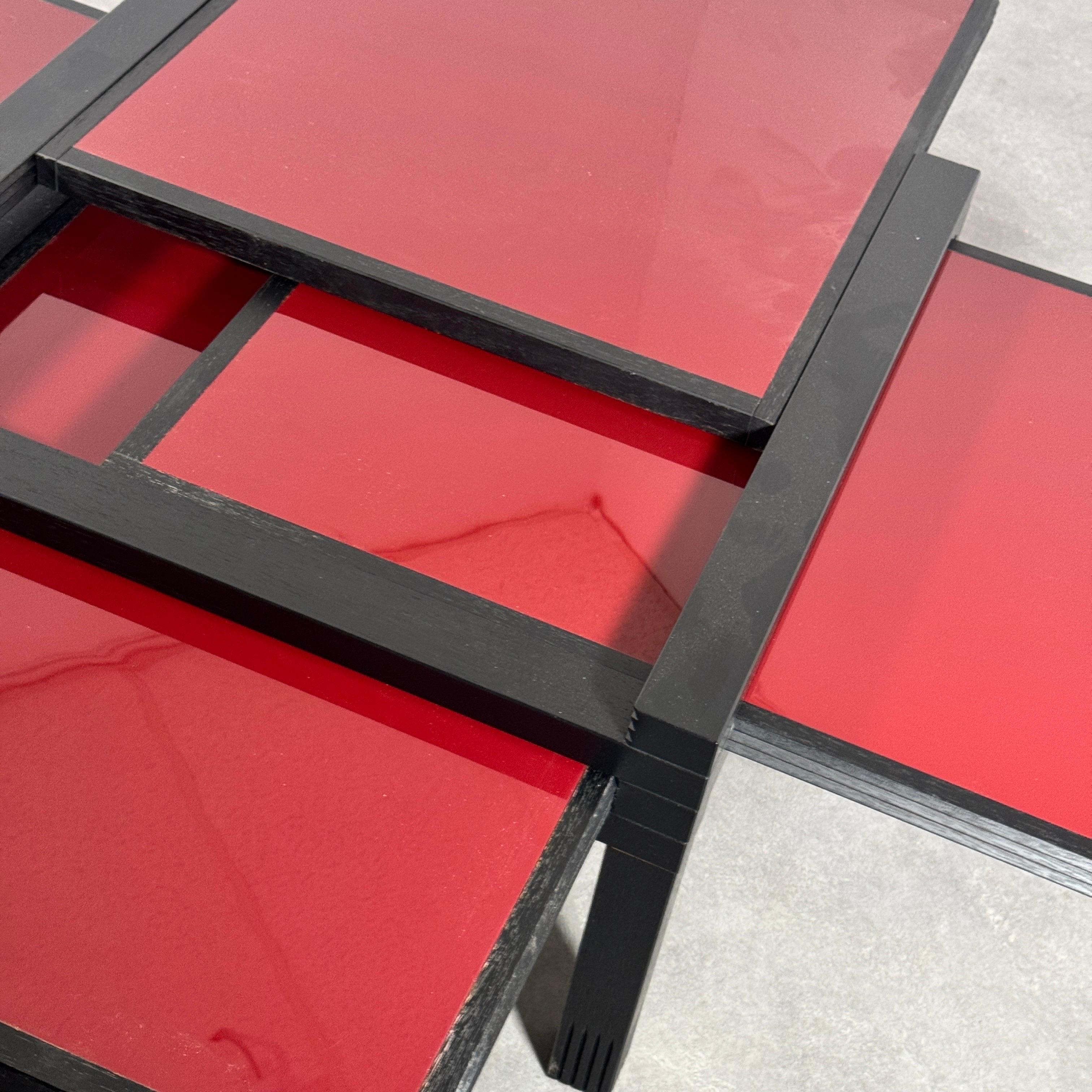 PAR4 coffee table by Bernard VUARNESSON (France 1935) for Bellato International srl, Italy late 1980s. 

Four double sided sliding table tops that can be adjusted so suit your own creativity. 4 sides are stylish glossy burgundy red and four white