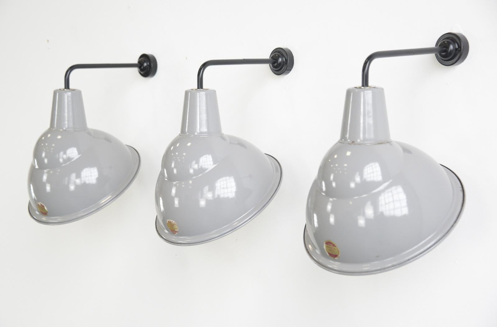 Parabolic grey enamel wall lights by Benjamin circa 1950s

- Price is per light 
- Vitreous grey enamel with white enamel inners
- Takes e27 fitting bulbs
- Wires directly into the wall
- English ~ 1950s
- 33cm wide x 45cm tall x 35cm