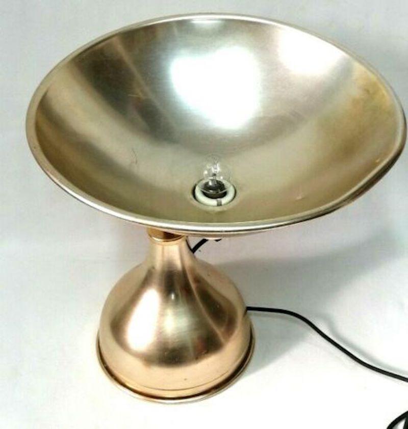 Large lamp in original golden aluminum from the 1960s, with an unusual parabola shape with central light point, conical base

it measures about 50 cm in height, diameter of the illuminated part 40 cm

Very good storage conditions, as shown in