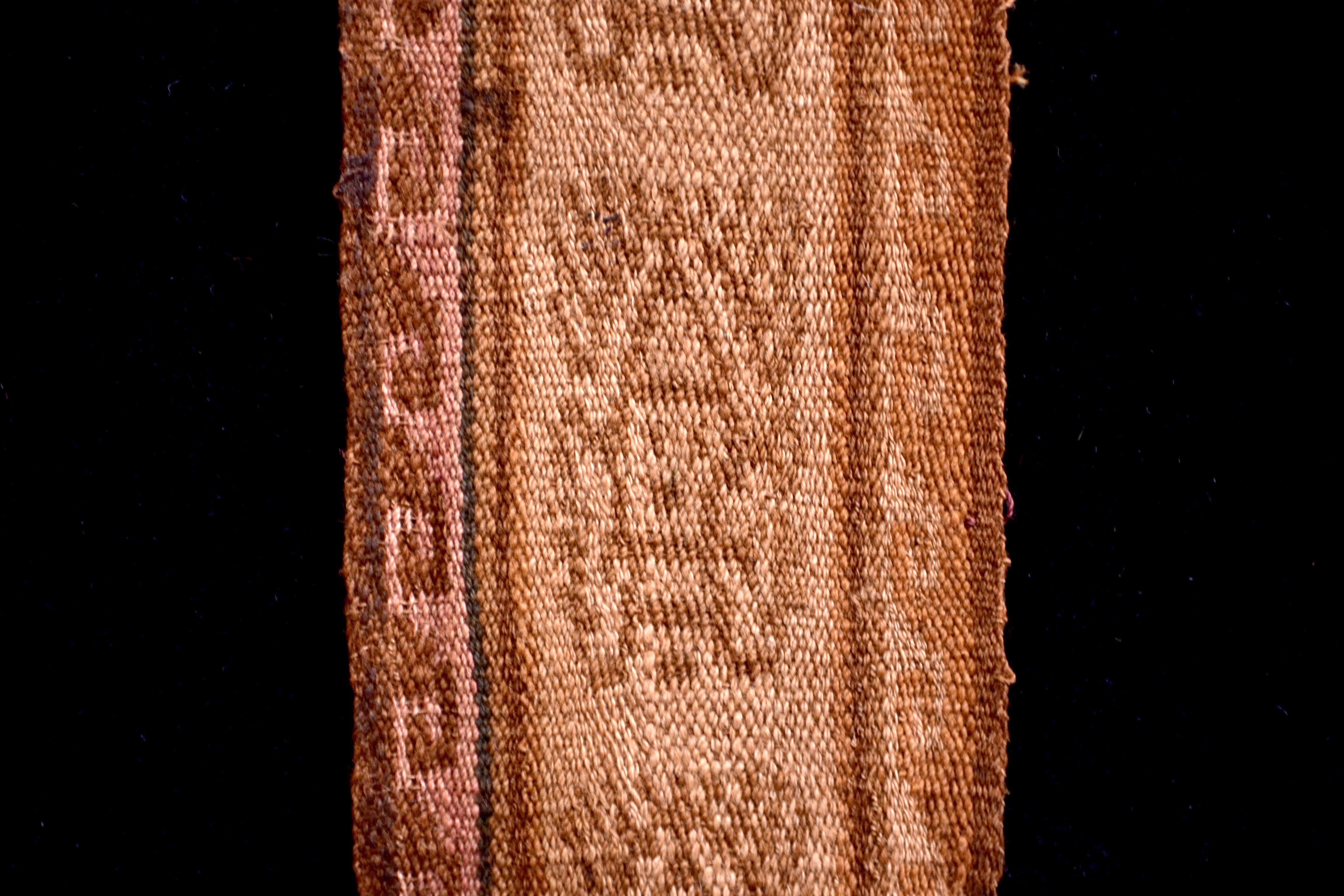 Earth tones pre-Columbian textile fragment with 5 embroidered anthropomorphic shaman figures. This piece is framed in a black shadowbox.

It is a wonder to behold antiquities such as a pre-Columbian textiles, an authentic piece of art that has been