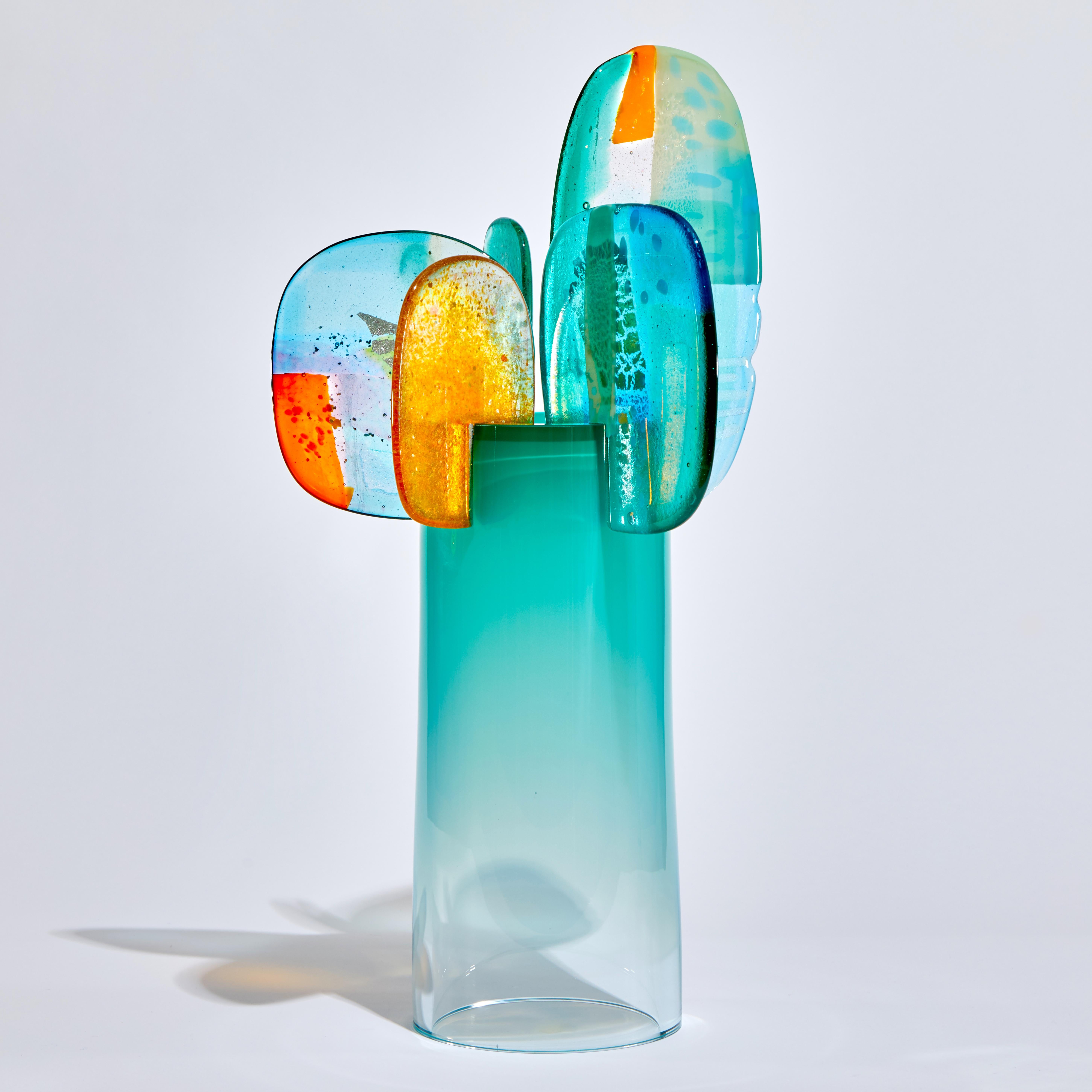 'Paradise 01 in Emerald' is a unique glass sculpture created using hybrid hand-made glass techniques by the British artist Amy Cushing. Combining mouth blown glass with kiln formed glass, each piece within the collection displays a multiple of