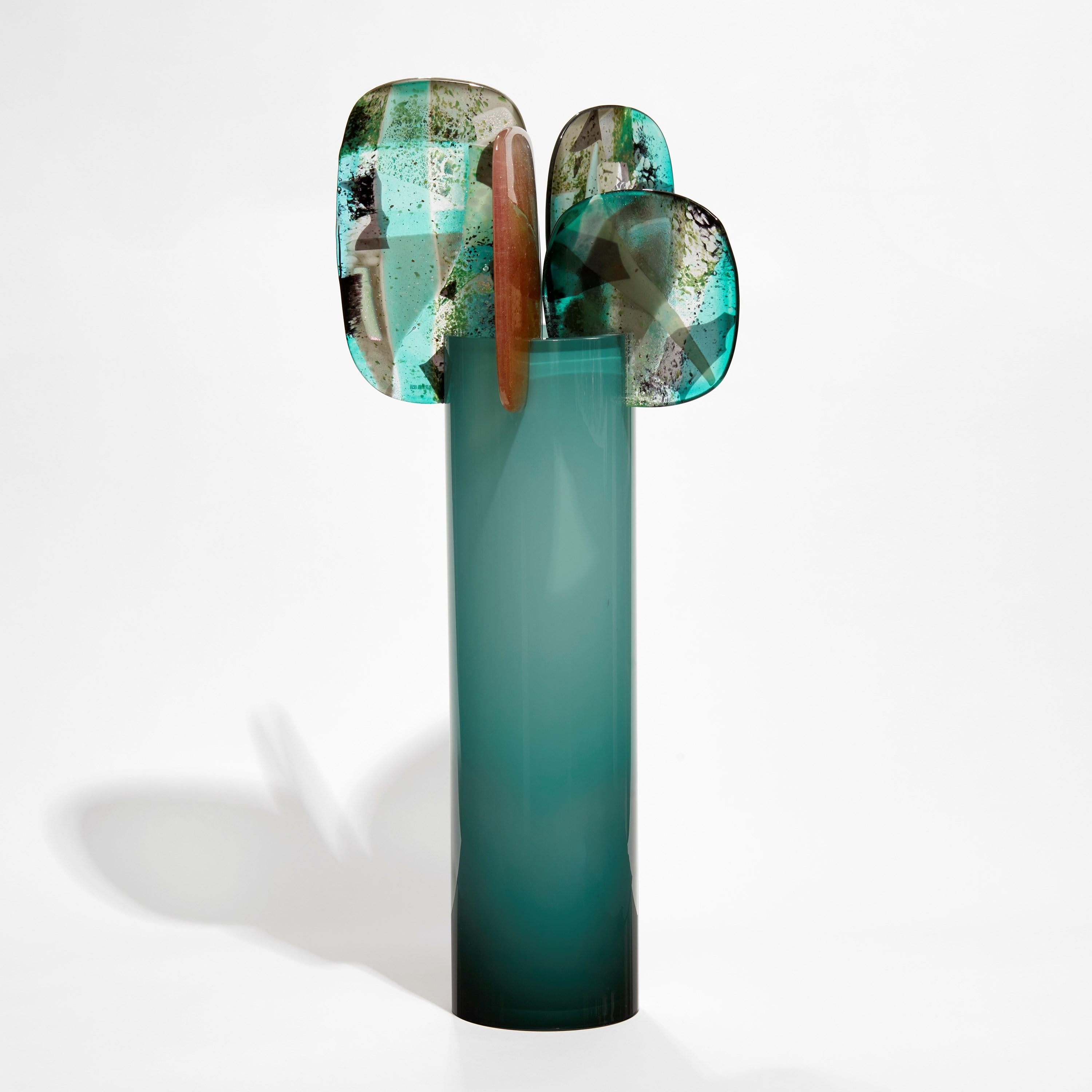 'Paradise 03 in Teal' is a unique teal green and pink glass sculpture created using hybrid hand-made glass techniques by the British artist Amy Cushing. Combining mouth blown glass with kiln formed glass, each piece within the collection displays a