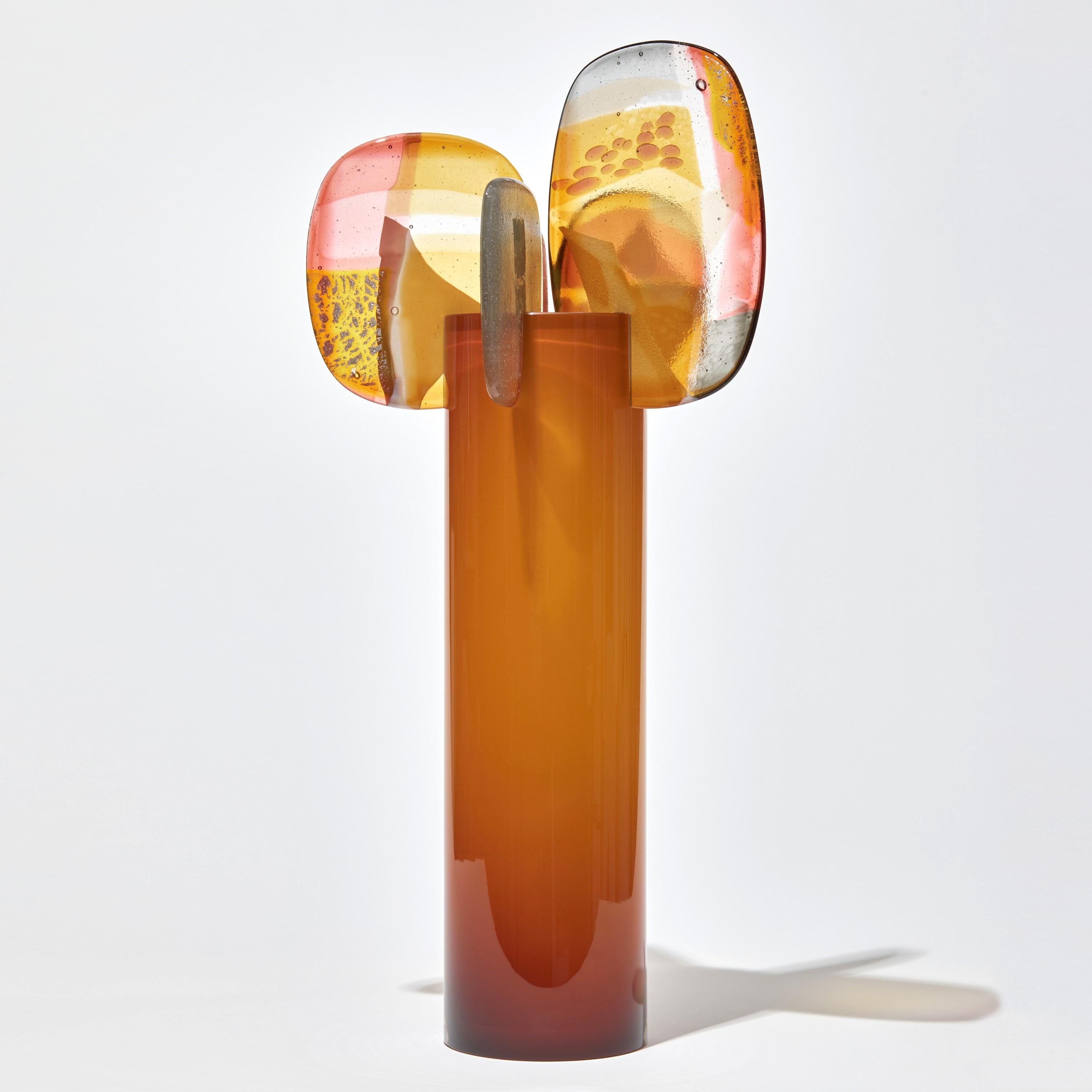 'Paradise 04 in Amber' is a unique glass sculpture created using hybrid hand-made glass techniques by the British artist Amy Cushing. Combining mouth blown glass with kiln formed glass, each piece within the collection displays a multiple of highly