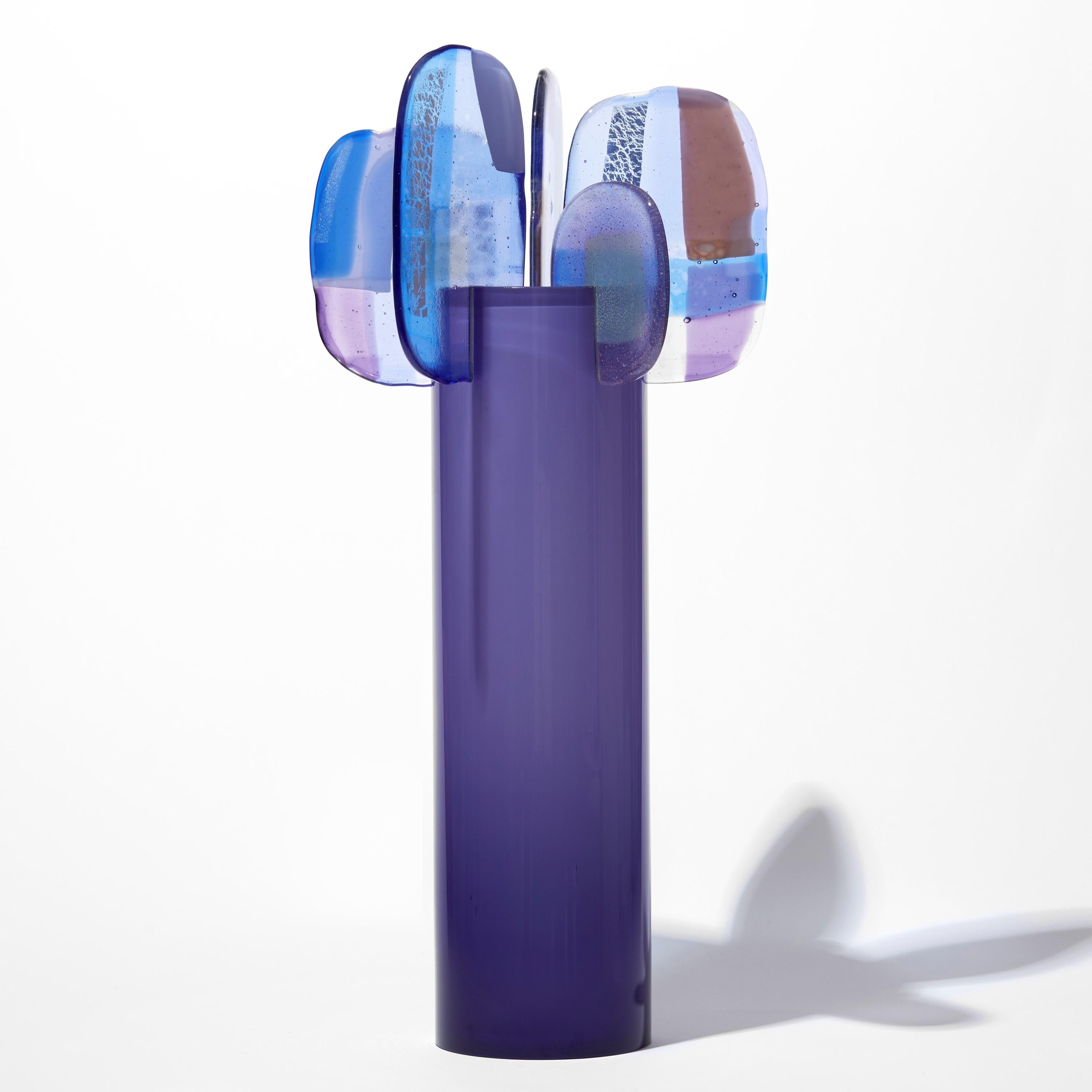 'Paradise 08 in Amethyst' is a unique glass sculpture created using hybrid hand-made glass techniques by the British artist Amy Cushing. Combining mouth blown glass with kiln formed glass, each piece within the collection displays a multiple of