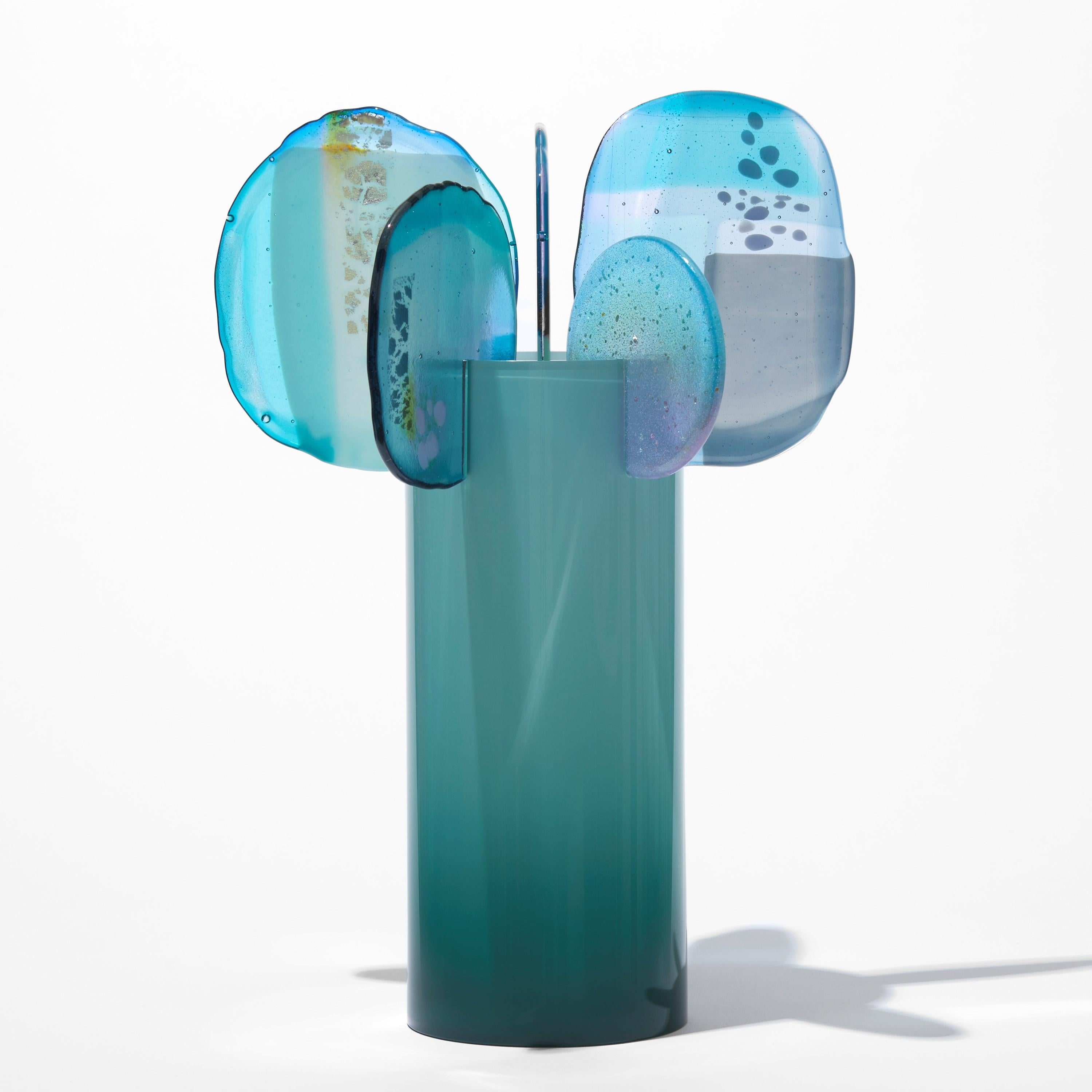 'Paradise 08 in Jadeite' is a unique glass sculpture created using hybrid hand-made glass techniques by the British artist Amy Cushing. Combining mouth blown glass with kiln formed glass, each piece within the collection displays a multiple of