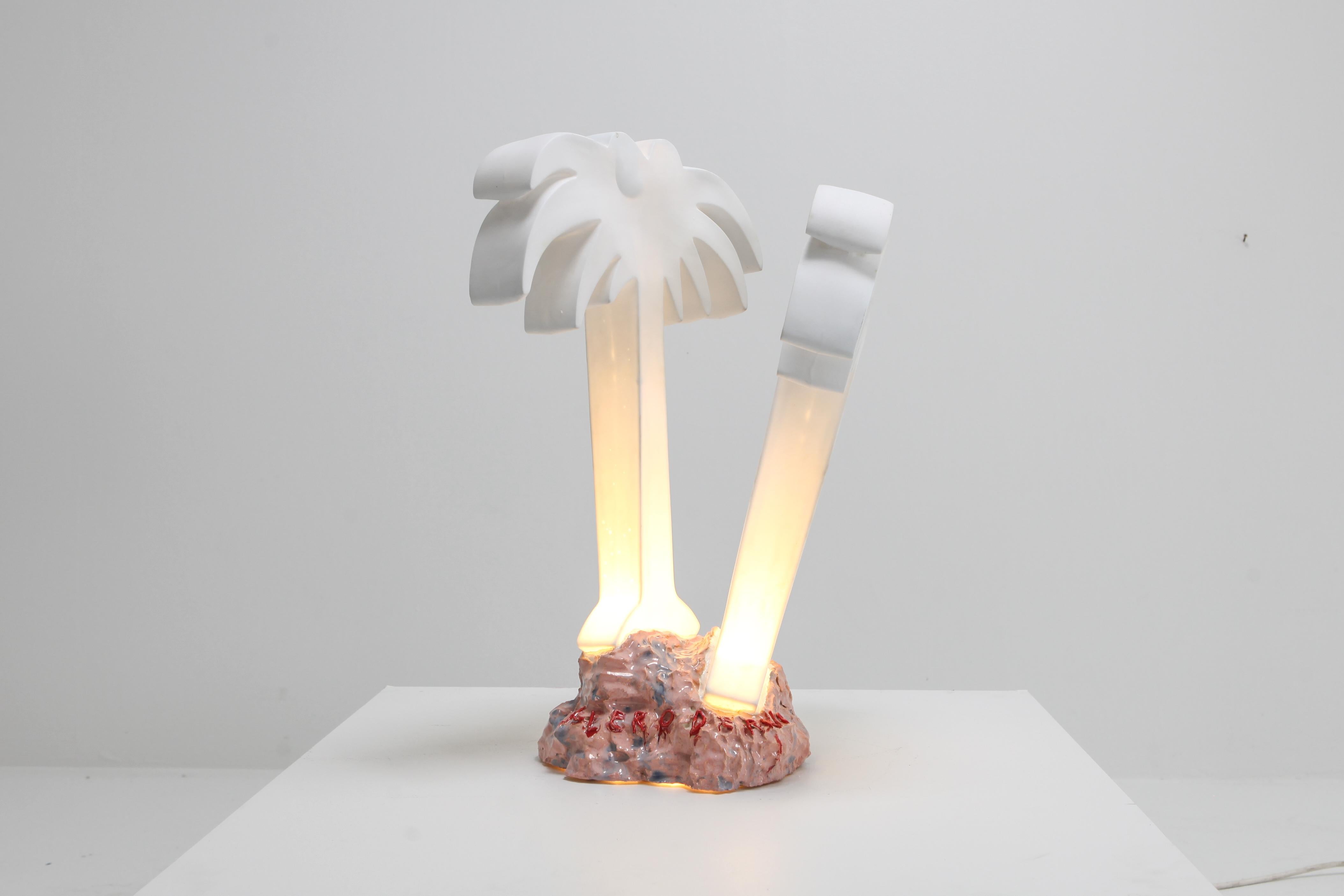 Postmodern style porcelain palm tree table light on ceramic base.

Part of a series of three different unique light sculptures

Contemporary take on a Memphis vs Hollywood Regency style piece.