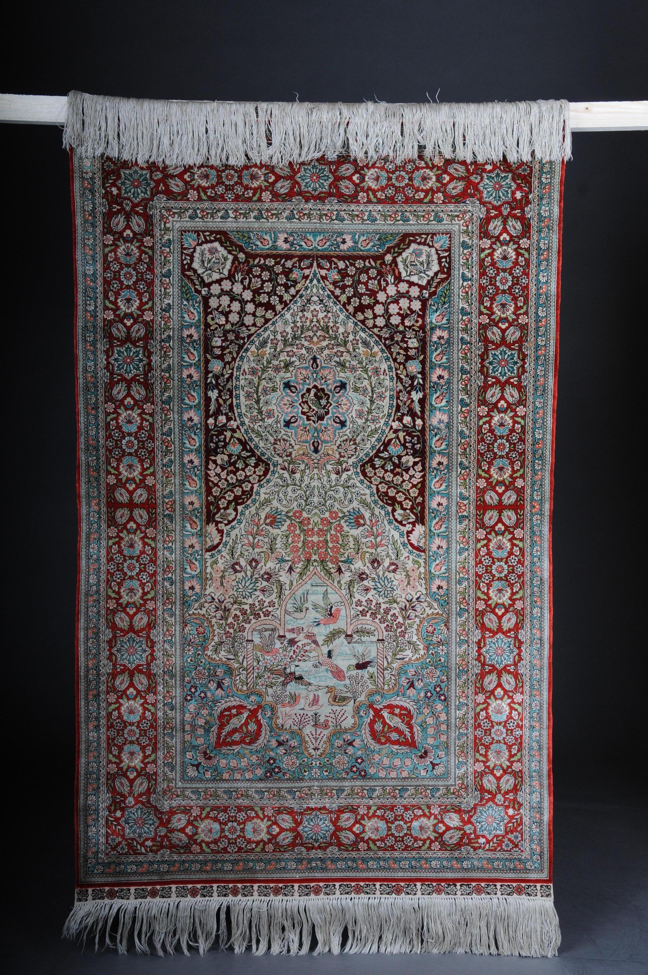 Paradise prayer rug, silk, end of the 20th century.

Silk on silk. Brightly colored mirror with field-filling matching oval medallion and pendants.
Dense silk pile. All-round original finals. Fine silk extremely fine weave in good
