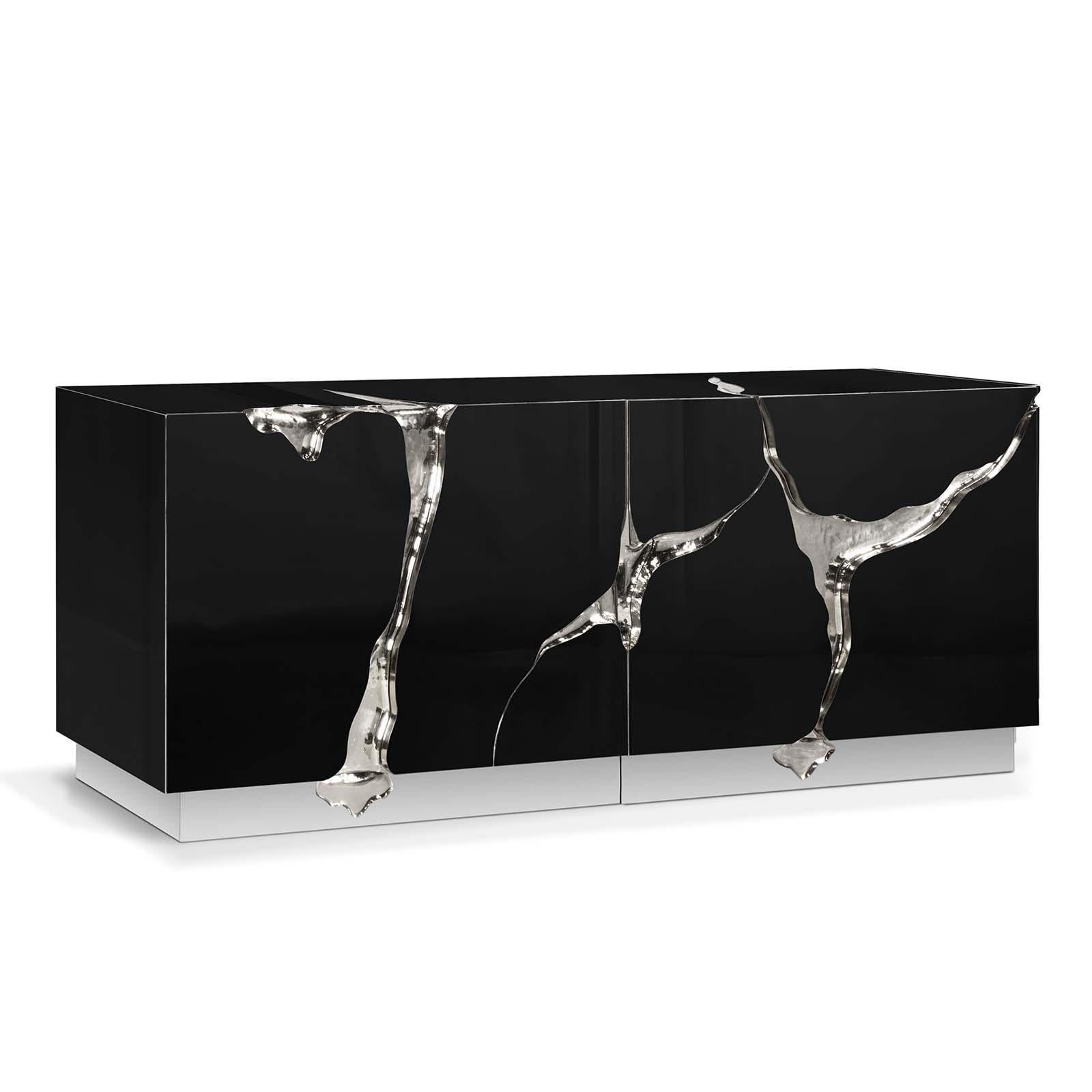 Sideboard paradise in silver finish with wood carving 
structure with details finished in polished steel in silver
finish. Coated with polished stainless steel. Inside in
poplar wood veener. Exceptional piece.